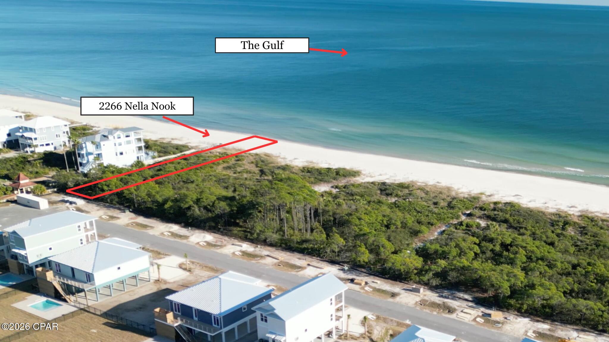 SALTWATER LIVING BECKONS!! Discover an extraordinary opportunity to own one of St. George Island's most desirable Gulf-front homesites at 2266 Nella Nook. Nestled within the exclusive gated Plantation community, this exceptional property offers approximately 52 feet of direct Gulf frontage, providing the perfect canvas to design & build the coastal retreat you've always envisioned. Wake each morning to the sound of gentle waves rolling onto sugar-white sands & spend every evening captivated by breathtaking sunsets painting the horizon in brilliant shades of orange, pink & gold. Life within The Plantation is defined by privacy, natural beauty & resort-style amenities. Residents enjoy gated security, beautifully maintained surroundings, miles of uncrowded beaches, scenic nature trails, tennis courts, fitness facilities, swimming pools & convenient access to the island's outdoor recreation. Explore winding bike paths beneath swaying palms, launch a boat for a day on the water, cast a line in world-class fishing grounds, paddle through serene coastal waters, or simply relax with your toes in the sand while enjoying the tranquil Gulf breeze. Beyond the gates, St. George Island is celebrated for its laid-back charm, unspoiled landscapes & abundant wildlife. Nearby restaurants, shops, marinas & state parks offer endless opportunities for adventure while preserving the peaceful atmosphere that makes the island one of Florida's most treasured coastal destinations. Here, every day feels like a vacation where nature, recreation & relaxation blend seamlessly together.  Rare Gulf-front opportunities like this are becoming increasingly difficult to find. Secure your place on one of the Forgotten Coast's most coveted shorelines & create a custom beachfront sanctuary tailored to your lifestyle. This is more than a homesite--it's an invitation to embrace luxury coastal living, spectacular scenery & unforgettable memories for years to come to LIVE THE BEACH LIFE!!