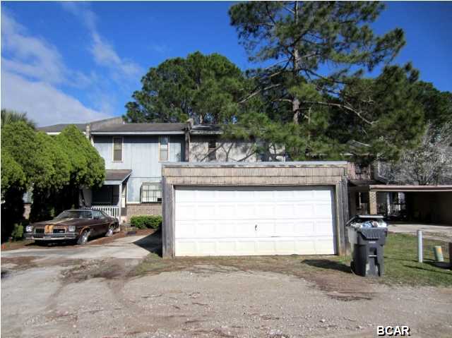 UNBELIEVABLE PRICE FOR A WATERFRONT TOWNHOME WITH A DOCK OVERLOOKING EAST BAY! This three bedroom townhome features a living area, kitchen and half bath on the first floor. The second floor has a Master bedroom with a balcony that overlooks the water. There are two additional bedrooms and full baths on the second floor. The property is deep and has a secured chain-link fence before the water's edge. There is also an attached utility room on the back of the home. In front, there is a detached two-car garage. Home is being sold in its AS IS condition.