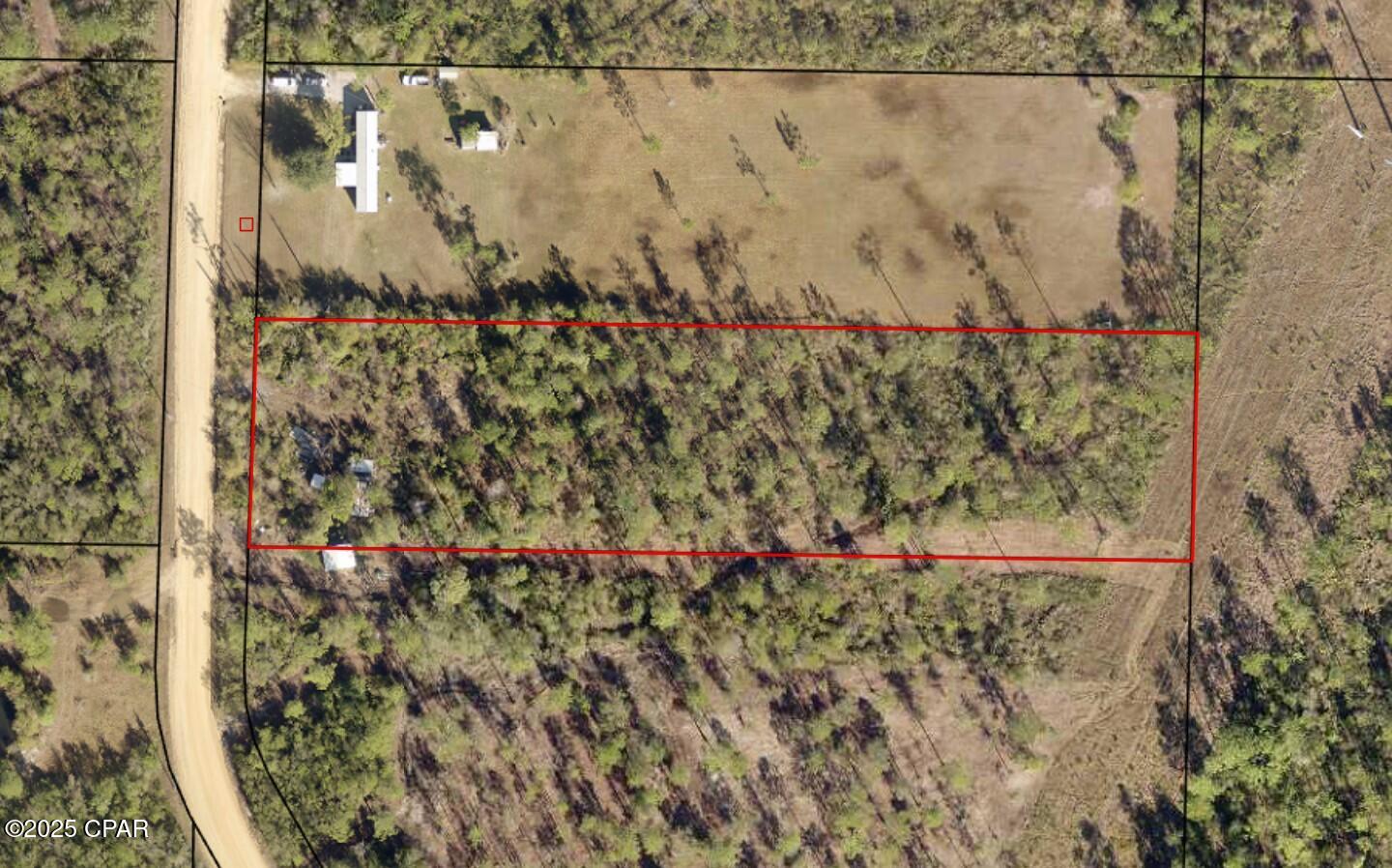 Peaceful country setting on 2.5  beautiful acres and only 30 minutes to Downtown Panama City. This large lot is ready for a new house, with electric service on site, a 4' deep well, and modern septic system on site. Various storage sheds are included. 

Located a quiet dirt street only a block from paved road with easy access to Hwy 231.  Youngstown Recreational Park & Pitt & Sylvan Springs Park are minutes away, and nearby Hwy 20 and Hwy 10 connect you to the rest of the Florida Panhandle. Several stores located nearby for groceries and supplies. No HOA.

Bring your contractor and check it out! Manufactured homes allowed.