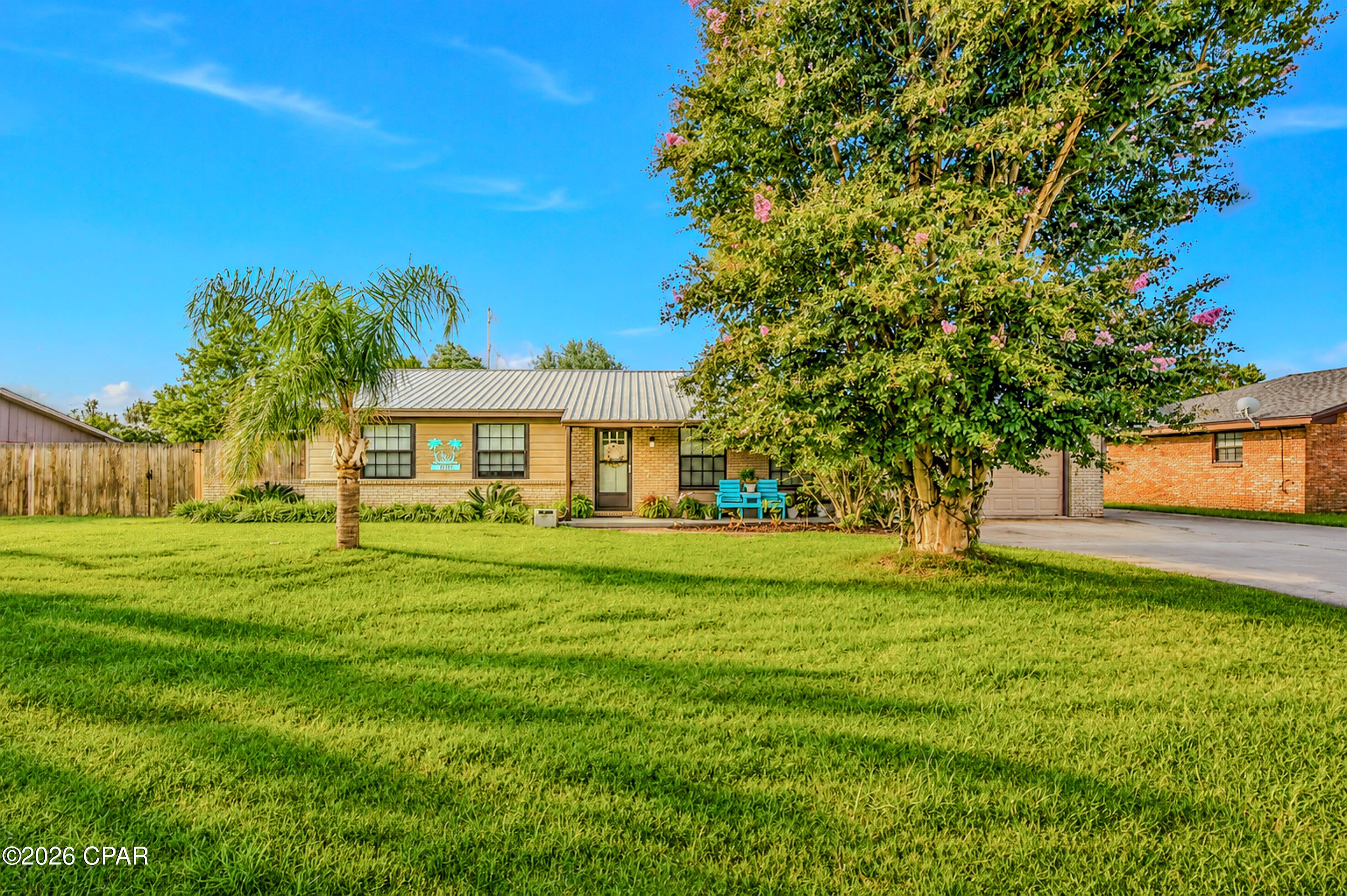 3-bedroom, 2-bathroom home located in the heart of Panama City!

This beautiful home features a fully renovated kitchen with stunning waterfall countertops, a large kitchen island with plenty of storage, and bar stools that can stay with the home. The open floor plan is perfect for entertaining and includes a versatile bonus room that can be used as a game room, office, playroom, or second living space.

The spacious bedrooms offer plenty of natural light, while the primary suite features its own private screened-in patio, creating the perfect place to relax.

The 2-car garage provides ample storage, and the extended concrete driveway offers plenty of room for multiple vehicles, boats, RVs, or trailers.

Step outside to a backyard that's been freshly sodded and transformed into your own private oasis. To make moving even easier, the hot tub, washer, dryer, and garage refrigerator all convey with the home!