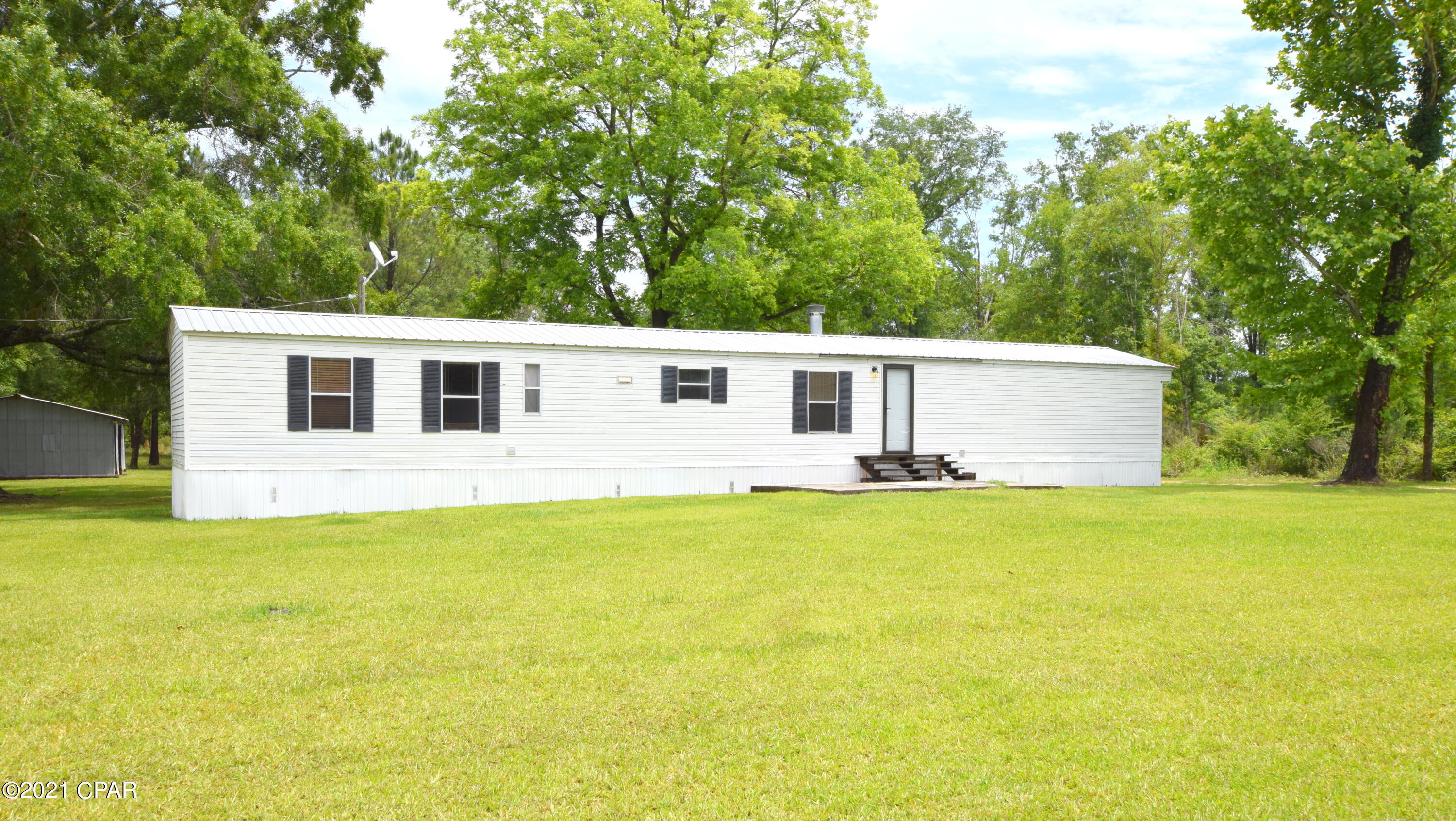 Peaceful Country living! This spacious 3-bedroom, 2 bath mobile home has been well kept and ready for a new family! Inside features include a spacious living room with wood burning fireplace, laminate flooring, eat-in kitchen, and a large master suite with walk-in closet and custom shower. Outside there is plenty of room to spread out and enjoy life, sip coffee from your back porch, tinker in your 34x30 barn, fish in the pond or watch the kids play in the 6-acre yard. Property is conveniently located close to Hwy 273 and Hwy 231.