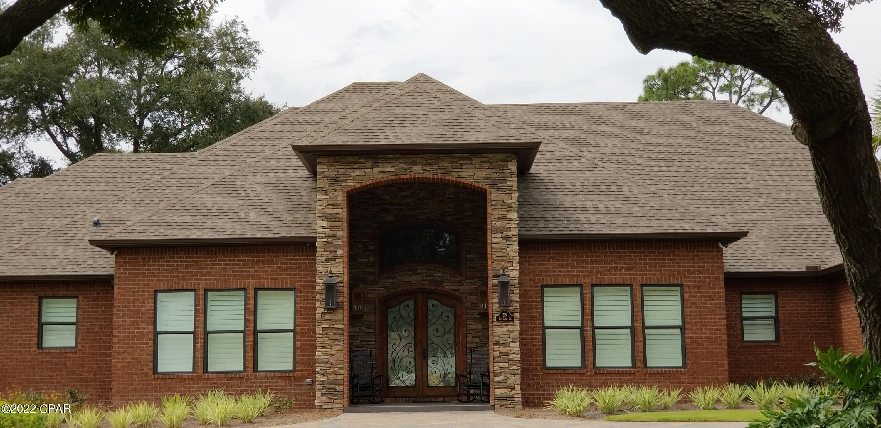 1 ACRE/WATERFRONT!! ONE OF A KIND CUSTOM HOME.  Almost 8500 Total Sq Ft with a BOATHOUSE and TWO BOAT LIFTS.  Screened in Pool Overlooking the Canal and Water Toys.  This Beautiful Home Features a wonderful Open Floorplan...As you walk in the Tremendous Double Wood and Iron Front Doors you enter the 18 foot high Foyer and can see through to the FOUR PANEL Sliding Glass Doors overlooking the Screed in Pool and Canal.  The Chef's Kitchen left no detail out.  From the 60 inch Six Burner Gas Stove with Two Ovens (With Pot Filler) to the Wall Oven/Microwave Combo UNIT with Warming Drawer to the 48 inch Side By Side Built In Refrigerator to the Eat In Breakfast Table and Bar...The Kitchen alone can seat 12 people, not including the Formal Dining Room.  The Master Suite is a true Oasis. The Spacious Master Bedroom has a large Electric Fireplace under the 65 inch TV that drops out of the Ceiling.  The oversized His and Hers Closets feature Built In Custom Furniture and the 2nd Laundry Room is right between the two closets...  But the best part of the Master Area is the Spa Bathroom.  The separate sink areas split the room and are on either side of the wonderful soaking tub which sits in front of a shower to out of this world...the back wall of the 10 foot high shower is adorned with 2 each, 5 foot wide by 10 foot tall Book Matching Porcelain Slabs with Black Stone Accents on either side.  The Bathroom Floor is Beautiful 24 x 24 Porcelain Tile.  A Must See!!  One of the Additional Bedrooms currently acts as a Home Office and has it's own Full Bath.  The other two Bedrooms are Jack & Jill Style with each having their own separate Sink Area.  Upstairs is the ultimate Media Room/Man Cave/Game Room...Three 75 inch TVs are on one wall and a Wet Bar is on the opposite wall.  At the far end of the Room is an 8 foot Pool Table.  The room has tremendous storage areas behind the walls, a large closet, and A Full Bath round out the upstairs.  A great Mud Room leads to a Small Workout Area under the Stairs and the 2nd Laundry room for your guests.  As you exit the Mud Room the Garage you will be amazed...The Garage is an Oversized 3 Car (or Truck) Area with extra Storage/Workshop.  The Garage is 1800 Sq Ft and it has Its own HVAC System.  The House also has Impact Windows throughout and the entire house and Roof deck is Spray Foamed for your energy efficient Comfort.  Its a Smart Home has wonderful Millwork 2 gas Tankless Water Heaters and just so much more and too much to list here... A must see!!
(Media Room could be converted to two more bedrooms if needed)