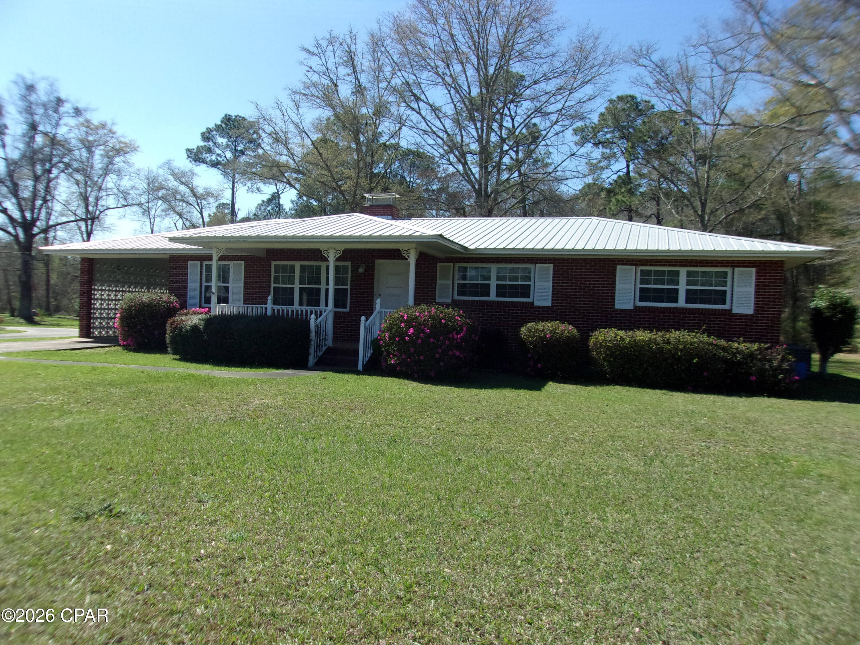 Discover this inviting 3-bedroom, 2.5-bathroom home tucked away on the peaceful outskirts of Bonifay, Florida. Set on a generous 3.27-acre lot--roughly half cleared and half beautifully wooded--this property blends comfort, space, and natural privacy in a serene country setting.
Step inside to a warm and functional layout. The heart of the home is a spacious kitchen boasting abundant real wood cabinetry and a convenient eat-in breakfast bar that opens seamlessly to a cozy den featuring a charming wood-burning fireplace--perfect for relaxing evenings. The primary bedroom offers a private half bath and an oversized closet, while all three bedrooms provide ample space for rest and retreat. A generous formal living room flows gracefully into a separate formal dining room, ideal for gatherings or everyday living.
Enjoy Florida's mild weather from the screened back porch--your perfect spot for morning coffee or evening relaxation. Convenience is key: all appliances remain, including the washer and dryer.
Outside, practical features meet curb appeal. A durable metal roof ensures long-term protection, complemented by a covered carport and a smooth concrete driveway with circle drive for easy access and plenty of parking. The wooded area behind the home delivers seclusion and endless possibilities for outdoor enjoyment.
Located just a short drive from local shopping, churches, and charming country restaurants, this property offers the best of rural tranquility with everyday conveniences nearby. Plus, you're only about 45 minutes from the stunning white-sand beaches of Panama City Beach.
Don't miss this rare opportunity to own a spacious, move-in-ready home with acreage in a friendly Panhandle community. Schedule your showing today!