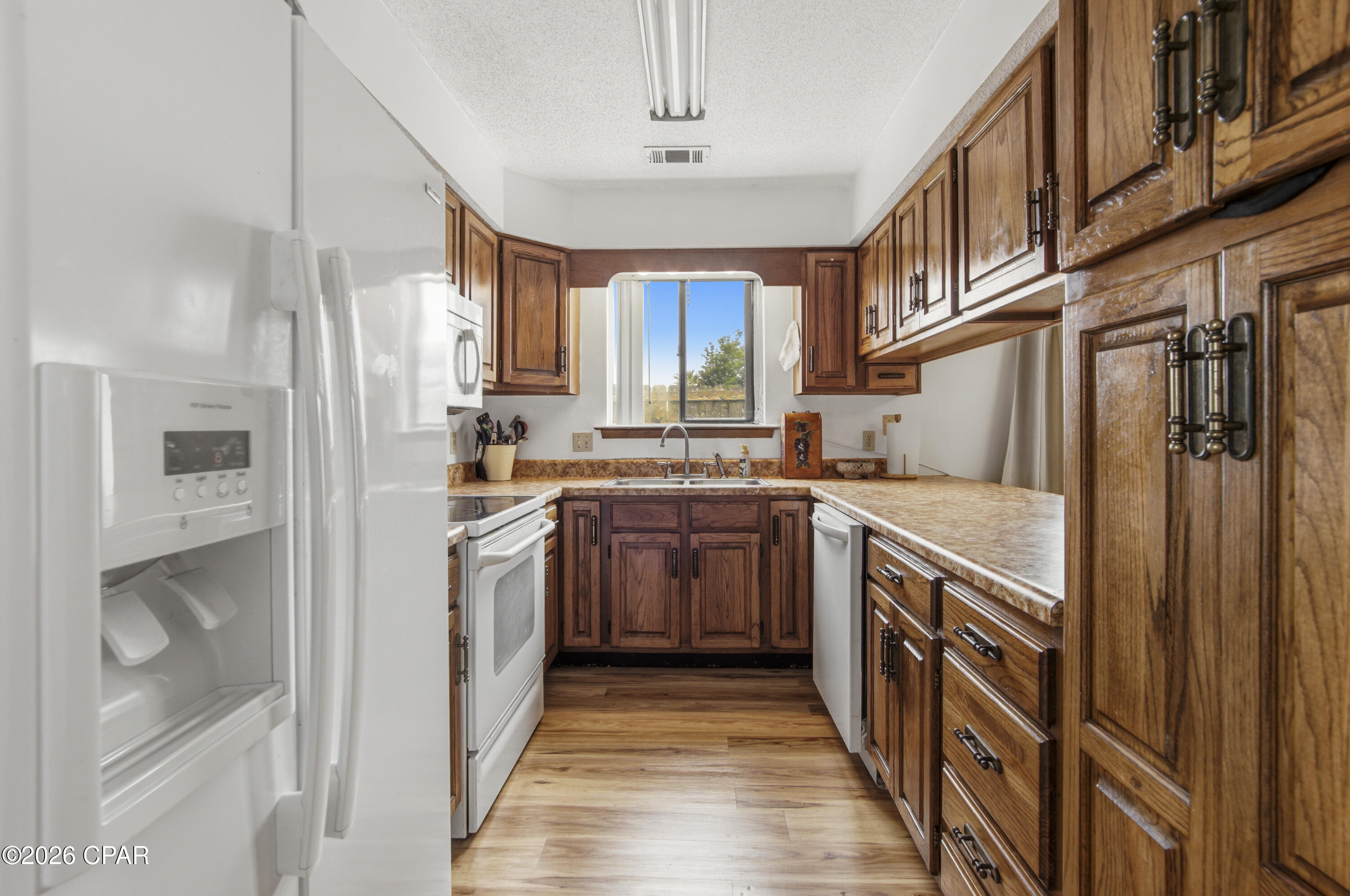 Calling all first-time homebuyers and investors! This move-in-ready 2-bedroom, 2-bath attached home is full of potential and ready for your personal touch. Whether you're looking for an affordable place to call home or your next investment opportunity, this property offers the chance to add your own style while building equity.



A standout feature is the detached shed, complete with electricity, internet, and soundproofing--making it the perfect home office, workshop, studio, or hobby space. Additional updates include a updated LVP flooring throughout the home 2022 and 2023 water heater. The home is connected to city water and sewer. 



A rare bonus is the ability to park a small RV, boat, or jet skis in your backyard with access through the city easement located one unit over, providing added convenience for outdoor enthusiasts.



Ideally located in the heart of Lynn Haven, you'll be just minutes from shopping, restaurants, schools, parks, and everyday amenities. Don't miss this opportunity to own a home with incredible potential in a prime location!