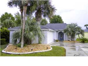 Just one look and you will see why the pool/patio homes in The Glades are so popular. 3 bedrooms, 2 baths, 2 car garage, pool, close to the beach, shopping, golfing... This well-kept home is move-in ready. The owners remodeled the kitchen and made the floor plan more open. Granite counter tops, white cabinets, a large snack bar and cheerful breakfast room are just some of the features of the kitchen. The huge great room/ dining area has soaring vaulted ceilings and is open to the kitchen. Step outside and you can enjoy the beautiful covered patio and screen enclosed pool. The back yard is bordered by a pond filled with lily pads. Back inside, the large master retreat also has vaulted ceilings and views to the pool and pond. The master bath and walk-in closet has all the space you