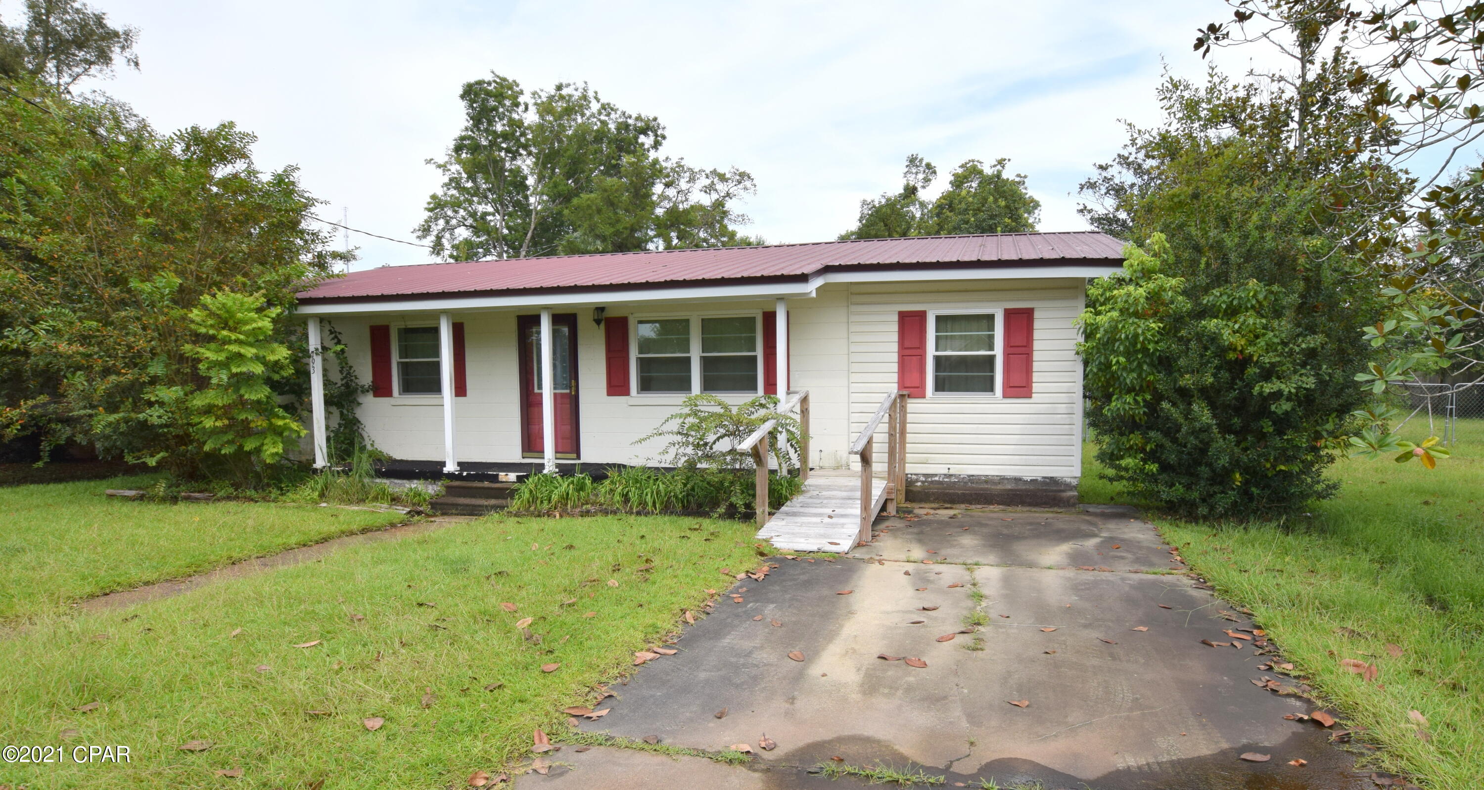 Located directly across from Shivers Park in the heart of Chipley sits this charming 2 bedroom, 2 bath beauty. Walk inside and you will find an open concept kitchen/living room, office, bedrooms with hard wood flooring and a spacious laundry room with full bath. Outside features include a metal roof, covered front porch, fenced back yard and 2 detached storage sheds. Home is located walking distance of hospital, schools and shopping.