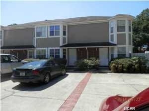 Newer build Town Home located on South Lagoon just across from the Lagoon, Close to boat launch and the beaches. Living room and dining combination, kitchen is located in the back portion of the 1st floor with laundry closet and access to the fenced back yard you also have a half bath on the 1st floor.. No Association fees with this building. The 2nd floor has 2 master bedrooms, each with private bath, one has shower only and the other has a combination tub and shower. This TH needs some TLC and appliances.
