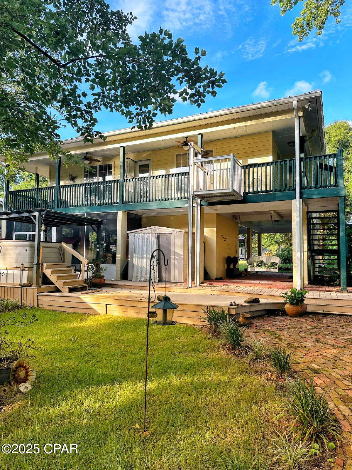 {WATERFRONT} Welcome to PARADISE on the Sister River! This beautiful home will check all of your boxes if you are looking for a semi-remote location that offers peace and quiet, along with a community of neighbors who will welcome you with open arms. The home is located in Steelfield Fishcamp on a canal that accesses the Sister River, which is about 4 miles from the Choctawhatchee River, which is another 8 miles from the Choctawhatchee Bay. This offers a beautiful boat ride to the Intracoastal waterway, Eden State Park, The Bay restaurant at the foot of the 331 bridge and many many other gorgeous places, including fresh water springs that you can explore right from your backyard. The home itself has never been rented. It is a large 2 bedroom 2 bath home that is elevated 14 ft above flood stage, but if the river does flood - (which happens every 3-5 years) you may need some rubber boots to get to your house. Downstairs offers a HUGE screened in porch area with a cook area and plenty of seating for your family gatherings. There is an elevator that is available for your convenience, which accesses the wrap-around porch that will give you a beautiful view of the water each time you walk outside. The home is equipped with all of the upgrades you would expect including granite countertops, custom cabinetry and stainless appliances in the kitchen. A wood burning fireplace will warm your heart and your soul on those cold winter mornings. The master bedroom is large with a french door to the wrap-around porch, and also features a master bath with double sinks, a large walk-in closet and a soaking tub, as well as a separate shower. The second bedroom is ample size and also has a walk-in closet with an ensuite full bath. This property is located about 25 min from Pier Park, also about 15 min from Latitude Margaritaville which is currently building a shopping center with a Publix and other stores that will be convenient to the location. The property is 9 miles from Hwy 79, and requires travel over 4 miles of unpaved roads to access the property - (see photo's), so it may not be appropriate if you do not have a vehicle that can tolerate dirt roads. There is a hot tub that will stay on the property and will not be warranted with the Lease, but the owner will allow Tenants to use the hot tub as long as they maintain it. The property is sparsely furnished as seen in the photo's. Owner will remove any furnishings that the Tenant does not wish to use prior to occupancy. Washer and Dryer are also available for use but not warranted. This property is available September 1, 2026.
