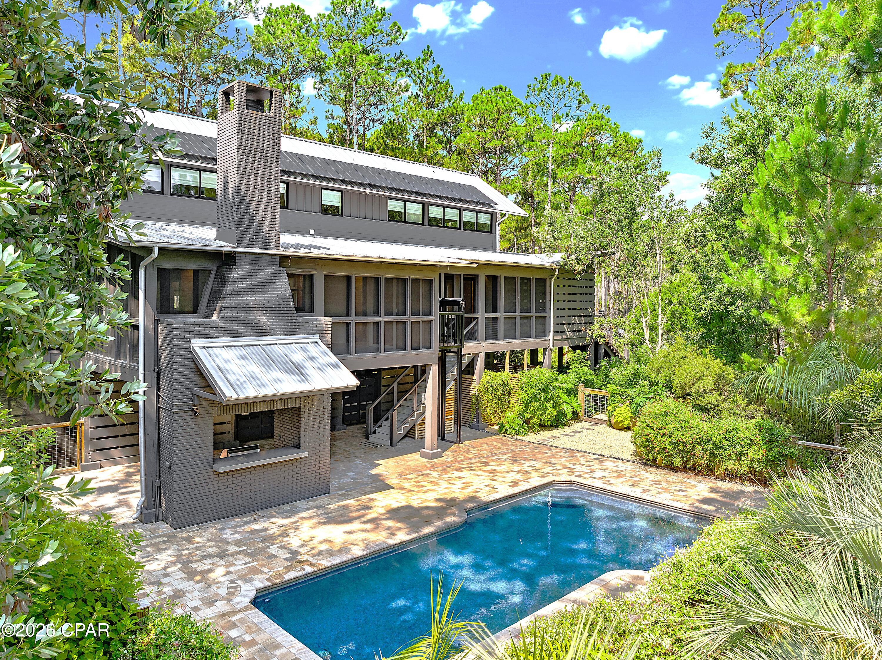 Stunning Southern Living home in the exclusive gated waterfront community of RiverCamps! Built in 2007, this beautifully updated 2,433-square-foot home offers 3 bedrooms, 3.5 bathrooms, and exceptional craftsmanship throughout. Situated on two lots totaling 1.95 acres with only one HOA fee, this rare property offers privacy, quality, and resort-style living.

Inside, you'll find hardwood floors throughout, tongue-and-groove walls and ceilings, custom built-ins, and timeless architectural details. Each of the three spacious bedrooms features a private en-suite bath, providing comfort and privacy for family and guests.

Recent updates include a new HVAC system, metal roof, appliances, water heater, washer and dryer, pool pump, solar system, and a private irrigation well. Enjoy peaceful pond views from more than 800 square feet of screened porches, a wood burning fireplace, relax by the private in-ground pool, and take advantage of the cargo lift for added convenience.
All appliances convey.

RiverCamps is a premier 1,500-acre gated waterfront community surrounded by West Bay, the Intracoastal Waterway, and Crooked Creek. With fewer than 450 homes planned, residents enjoy an unmatched blend of privacy and outdoor recreation, including a community pool, boat ramp with direct Gulf access via West Bay, day-use boat slips, more than seven miles of scenic trails and boardwalks, kayaking, boating, fishing, wildlife viewing, and golf cart-friendly streets. A new fitness center is currently under construction and is expected to be completed by the end of 2026.

Conveniently located just 10 miles from the sugar-white beaches of Panama City Beach and the shopping, dining, and entertainment at Pier Park, approximately 10 minutes from Northwest Florida Beaches International Airport, the new FSU Health hospital and medical campus, and only 2 miles from the new Publix and a planned 500,000-square-foot retail development, this home offers the perfect balance of peaceful coastal living and everyday convenience.

This is a rare opportunity to own one of RiverCamps' most distinctive homes in one of Northwest Florida's most sought-after waterfront communities. Close to everything yet far from the traffic and crowds!