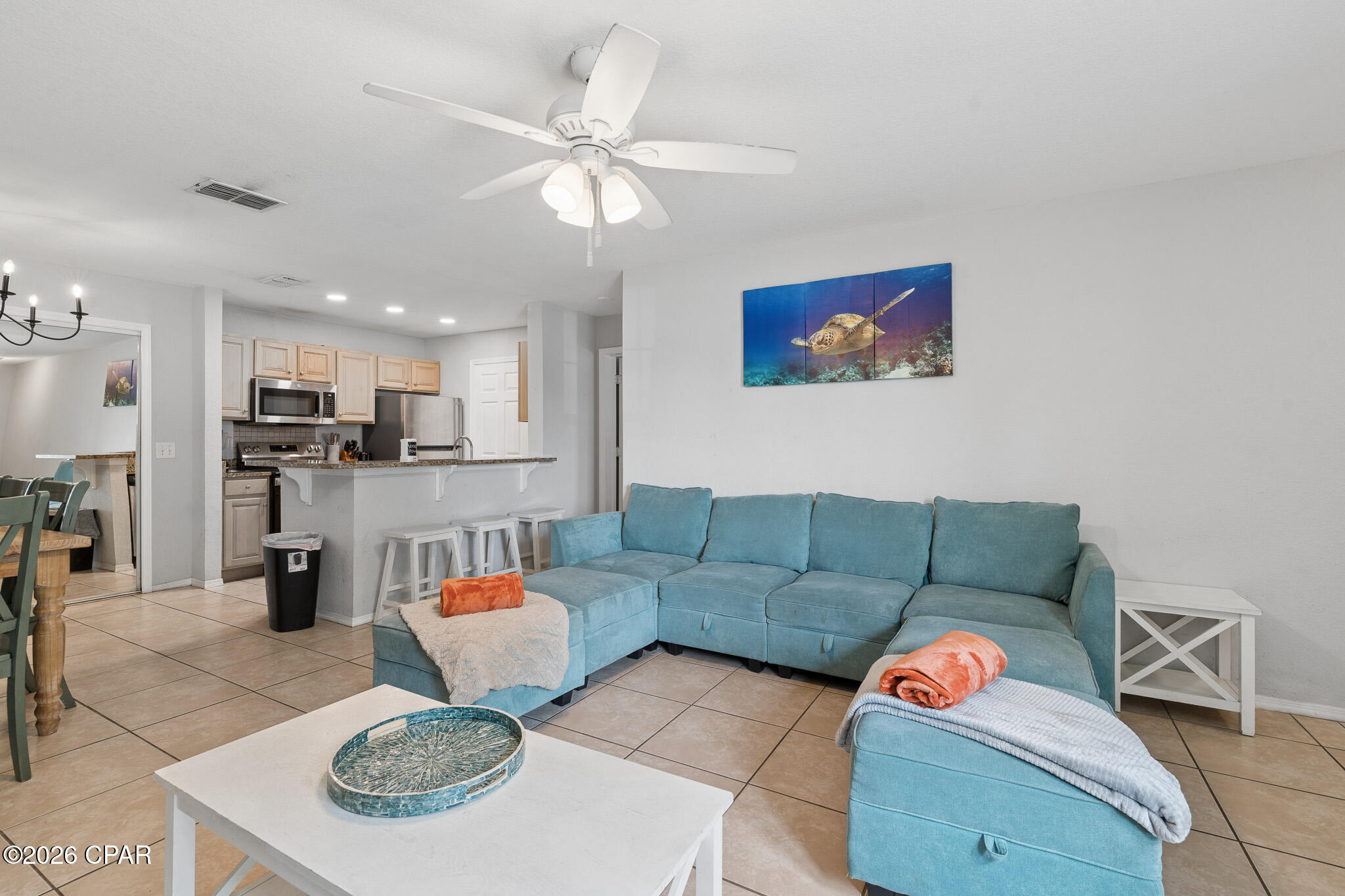 Rare opportunity to own a spacious 4-bedroom, 3-bath condo in the highly desirable Nautilus Cove community, located just one mile from the sugar-white sands and emerald waters of the Gulf. This coveted first-floor unit is one of only a select few within the community that allows short-term rentals, making it an exceptional investment opportunity, second home, or full-time residence. Estimated rental projections range from $66,000 to $86,000 annually.

The thoughtfully designed floor plan offers plenty of space for family and guests, while residents enjoy gated access and resort-style amenities, including a community pool, fitness center, clubhouse, and playground. Conveniently located near shopping, dining, entertainment, and Panama City Beach attractions, this property offers the perfect blend of coastal living, convenience, and income potential.  If measurements deemed important, please verify.