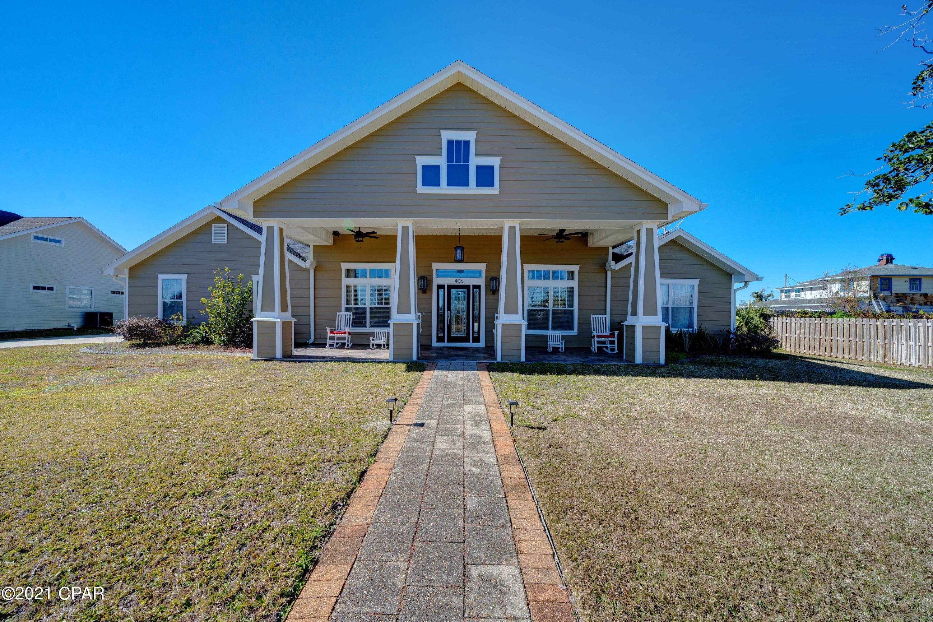 CURRENTLY UNDER CONTRACT, SELLER ACCEPTING BACKUP OFFERS. ***ENJOY THE SOUTHERN COASTAL LIFESTYLE in this BEAUTIFUL CRAFTSMAN STYLE HOME!!!***  This custom home by award-winning builder Rick Koehnemann is located in the highly desirable LYNN HAVEN area and features a BEAUTIFUL BAYOU VIEW and convenient location on a quiet street. New roof, new gutters, new paint, new fixtures, new fence, etc. in 2019. The home features a hardie board exterior, a welcoming 10 x 33 covered front porch, hardwood flooring in the main living areas, 12' ceilings, a clever office area, a split bedroom floorplan, an oversized garage w/ extra driveway parking, a covered lanai, a SALTWATER POOL, AND EVEN A POOL HOUSE that would make a great office, hangout, mancave or she-shed! The Grand Entryway invites you into the living and dining rooms and provides a wonderful entertaining space. The GREAT ROOM is located at the back of the home and features a large fireplace, is open to the kitchen, and has gorgeous views of the backyard and pool through the large picture windows. The kitchen will impress any chef with it's dual fuel gas range w/ pot filler, custom wood cabinetry, granite countertops, a large pantry, and even a BUTLER'S PANTRY/WINE BAR. The MASTER SUITE offers a relaxing sanctuary with a private SPA-LIKE BATHROOM featuring a large whirlpool tub, separate shower, and walk-in closet. The 2nd bedroom has an adjacent bathroom, and 2 more bedrooms have a shared bath. New pool cleaner and John Deere riding lawn mower also convey with the property. All this on a large 125 x 150 ft. lot. DON'T MISS YOUR CHANCE TO OWN THIS FANTASTIC HOME. CALL TODAY FOR MORE INFORMATION OR TO SCHEDULE YOUR PRIVATE TOUR!!!
