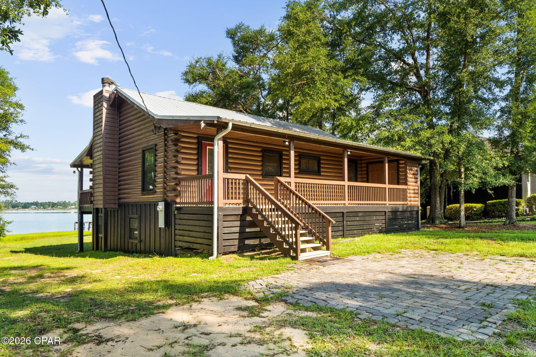 Wake up to breathtaking lake views and spend your evenings watching the sunset from the expansive covered porch at this beautifully updated log cabin retreat. Whether you're looking for a full-time waterfront home, a weekend getaway, or an income-producing investment property, this one checks all the boxes.

Offering 4 bedrooms, 3 full bathrooms, and over 2,100 heated and cooled square feet, the home features a spacious open-concept living area with soaring vaulted ceilings, warm wood finishes, and a stunning stone fireplace that creates the perfect gathering space. The remodeled kitchen is designed for both everyday living and entertaining with butcher block countertops, a farmhouse sink, pot filler, stainless steel appliances, and a large island overlooking the living room and lake.

The upstairs has been thoughtfully updated while the entire downstairs has been completely renovated with all-new electrical, plumbing, drywall, LVP flooring, paint, bathroom, appliances, and energy-efficient mini-split HVAC systems--creating the ideal space for guests, extended family, or rental potential. A Murphy bed in the guest room adds even more flexibility.

Outside, the lifestyle truly shines. Enjoy panoramic lake views from the oversized covered deck, launch a kayak, spend the day fishing, or simply relax and soak in the peaceful waterfront setting. A 12x32 workshop with power and window A/C provides plenty of room for hobbies, storage, or projects, while the freshly painted exterior, newly finished laundry room, owned Culligan water filtration system, and newer water heater and kitchen appliances add lasting value.

If you've been searching for a move-in ready waterfront property with character, modern updates, and endless possibilities, 3620 Seminole Lane is ready to welcome you home.

Whether you're searching for a primary residence, a peaceful weekend retreat, or a short-term rental investment, this property offers an incredible opportunity to enjoy lakefront living at its best.