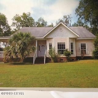 Perfect family home in Graceville. 3 Bedroom 2 Bath, Hardwood Floors, High Ceilings through out.  Open Kitchen with Breakfast Room, separate Dining room. Large Living Room with Fireplace, Bedrooms are spacious with plenty of closet and storage space., Bathrooms area large with storage closets in each.  Large laundry room,   Attached 2 Car garage, on 1/2 Acre lot. AC replaced 2017. Much more must see to appreciate.  Needs a little TLC to make it perfect. Dishwasher is Broken and washer dryer will not be included.