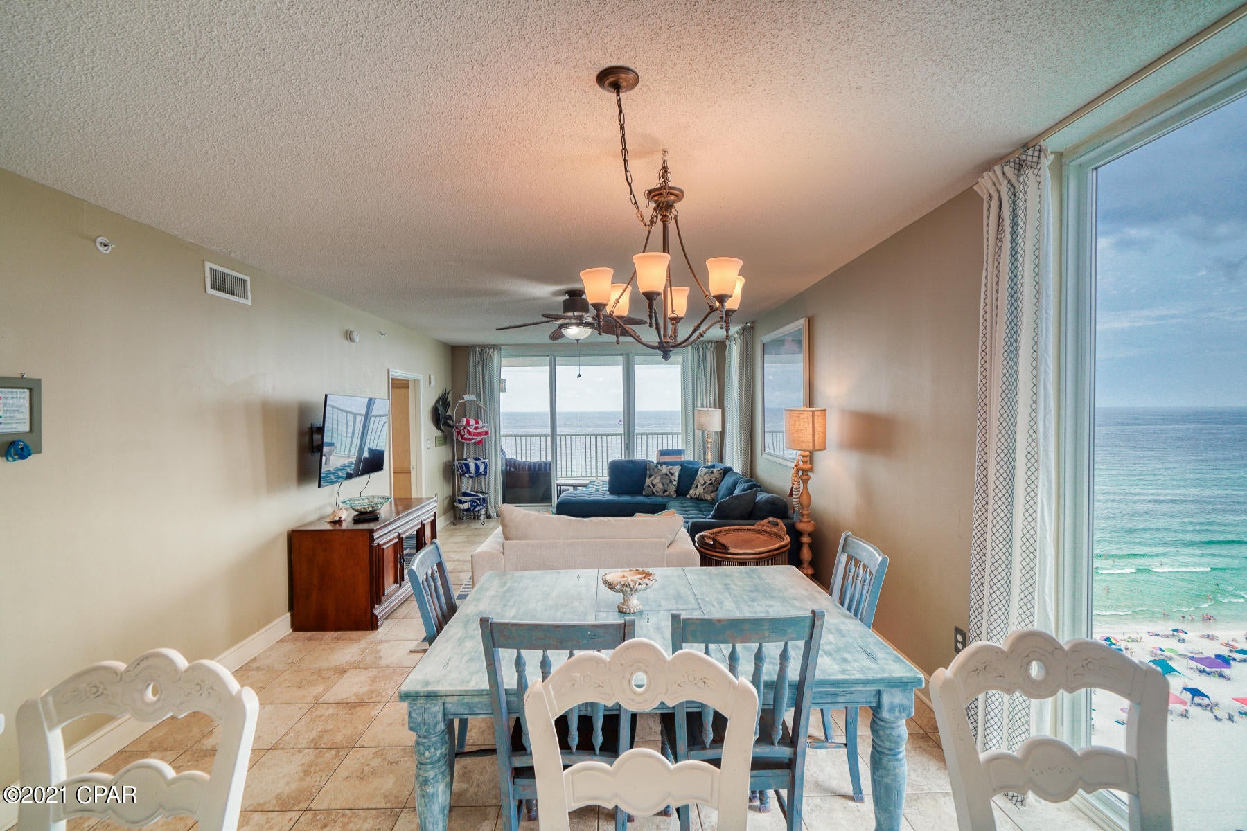 BEST FLOORPLAN IN MAJESTIC BEACH! TERRIFIC MID-STACK LOCATION!. TWO PRIVATE BALCONIES! HANDICAP ACCESSIBLE! This enormous, 1,610sqft west corner unit is the thing of which dreams are made, conjuring up images of sun-splashed days of swimming, biking and relaxing. It lives like a beach house but comes with all the benefits of owning a condo. Tiled throughout and conveys fully furnished, this property welcomes you to lie back, relax, and enjoy panoramic views of the pool, beach and ocean. Condo has 9' ceilings throughout. Open floor-plan allows for fabulous Gulf and sunset views from balcony, living room, dining room, kitchen, & master suite providing the ultimate alfresco living and entertaining environment! The fully equipped kitchen features GE appliances, granite countertops, and plenty of cabinet space. Sunset views from the private 390sq ft, wrap-around balcony are a perfect end to a sunny day and beginning to an exciting evening. This massive condo has 4 bedrooms & 3 full bathrooms. MAIN MASTER SUITE is front and center on the beach with direct access to the main balcony and private bath complete with jacuzzi tub and large walk-in closet. The master suite opens from a glass slider door to a covered balcony. In additional to the sliding glass door, a floor to ceiling window frames amazing views in essence, a wall of glass! SECOND MASTER SUITE also has it's own private bath. THIRD GUEST BEDROOM is large and has it's own private balcony. This bedroom has easy access to a 'Jack and Jill' bath that is shared with the FOURTH BEDROOM. Condo has a front loading washer and dryer. LUXURY! COMFORT! CONVENIENCE! Can be configured to sleep up to 12 people! EXCELLENT RENTAL INCOME POTENTIAL. Enjoy the good life at Majestic Beach with an unparalleled deck of resort style amenities including: 650 linear feet of sugar white GULF FRONTAGE, Four Large outdoor pools (2 at Tower I and 2 at Tower II), Two Indoor heated pools (one in Tower I and one in Tower II), Two hot tubs, Baby pool, Wading pool with waterfall, H20 Bar and Grill serving Gulfside/Poolside lunch and dinner, Large outdoor dining area, State of the Art Fitness center with steam room and sauna, 130 seat Stadium seating Movie Theatre, Convention center, Private Owner's Lounge with full Kitchen, Tennis Courts, Majestic Market featuring Starbucks coffee. Quick distance to the wonderful shopping, dining and entertainment at Pier Park. FROM THIS CONDO, YOU ARE WITHIN STEPS OF EVERYTHING YOU COULD EVER WANT AT THE BEACH!