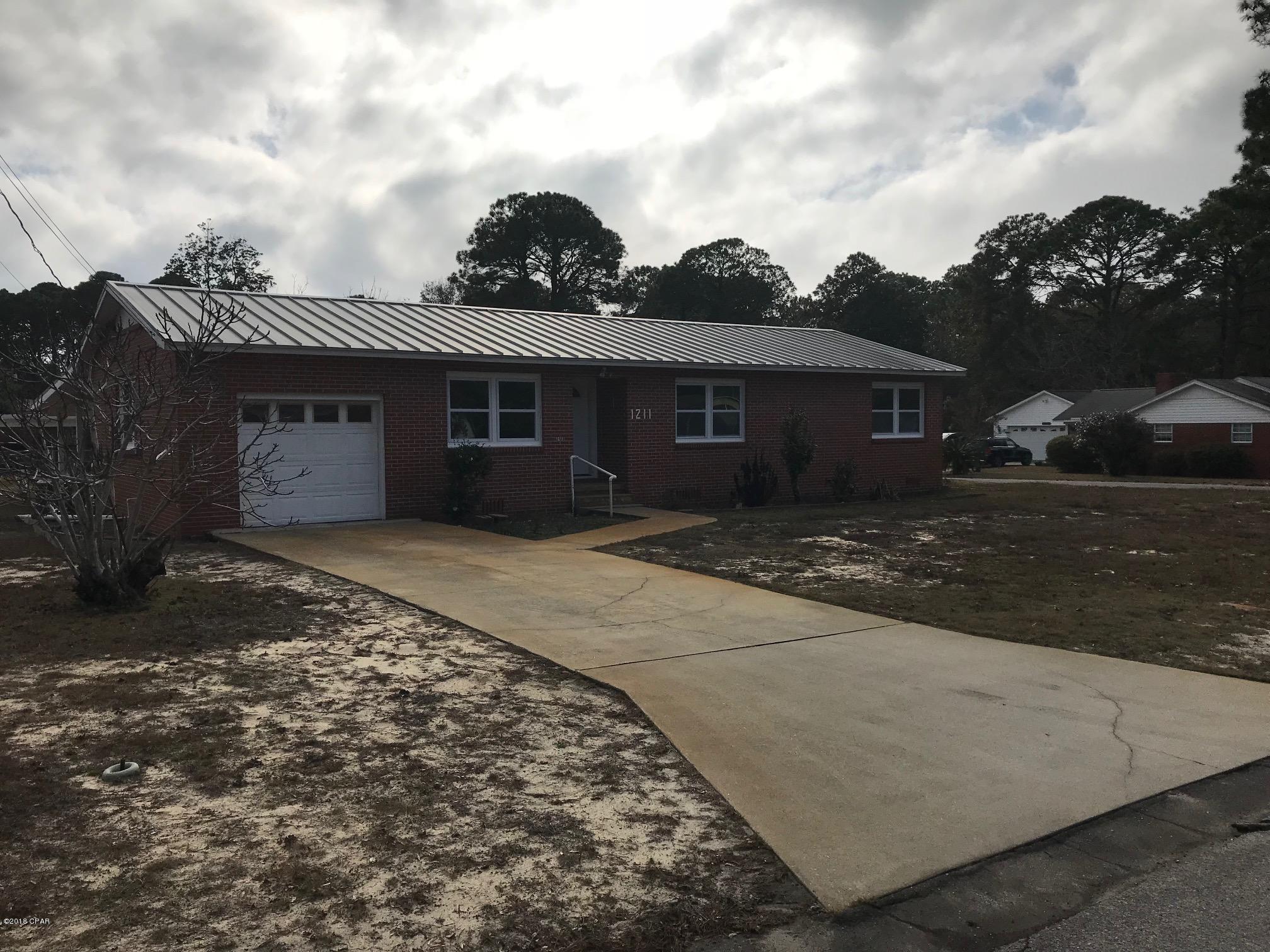 Fantastic brick home on large corner lot in Panama City.  Close to Down Town, short drive to Bay Medical, shopping an dining.  This home features original hard wood floors through out, all closets are cedar lined, completely repainted inside, new cabinets, granite counter tops and appliances.  The lot is completely fenced with chain link, one car garage, over-sized covered patio and carport, and includes a 2 story storage building.