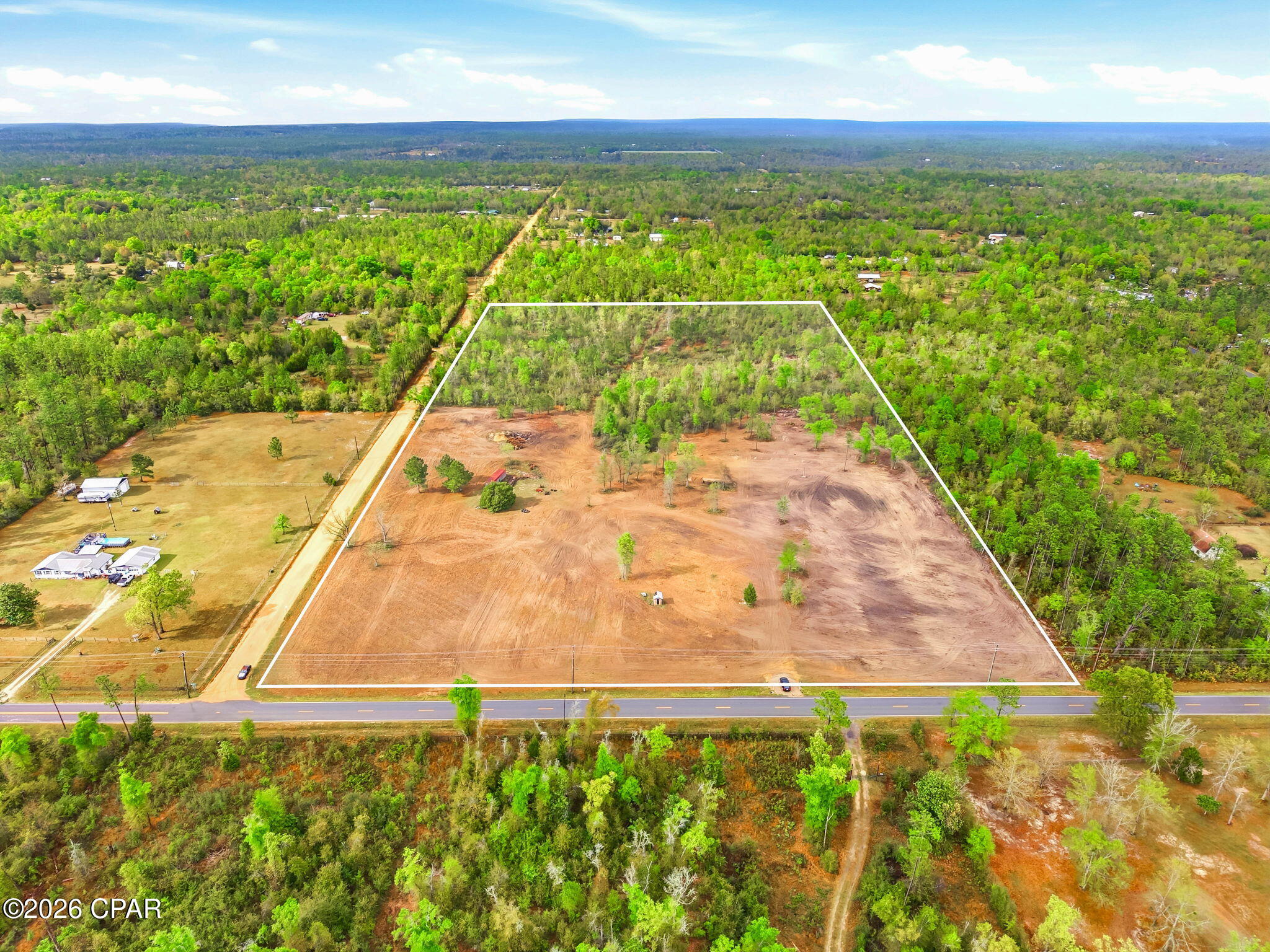 'CURRENTLY UNDER CONTRACT, SELLER ACCEPTING BACKUP OFFERS'. 20 acres located at the corner of Owenwood Road and Duffy Road in north Bay County, offering a strong combination of usability, access, and privacy. Approximately half of the property has already been cleared, providing an ideal setting for a homesite, pasture, or recreational use, while the remaining acreage is wooded for added privacy and flexibility.
Positioned on paved Owenwood Road, this property benefits from improved year-round access compared to many surrounding tracts located on unpaved roads. The corner location further enhances accessibility and layout options for future use, with approximately 665 feet of frontage on Owenwood Road and 1,314 feet along Duffy Road.
The land is zoned Agriculture and lies outside of designated flood hazard areas per available mapping , supporting a variety of potential uses including residential, agricultural, or investment purposes. The cleared portion offers immediate usability, saving significant time and cost for a future owner.
Conveniently located in the Fountain area of Bay County, with easy access to Panama City while still offering the space and quiet of country living. A great opportunity for those looking for acreage with improvements already in place. [A well and septic tank are located on the property; however, their condition and usability are unknown and not guaranteed. Buyer to verify all information deemed important.]