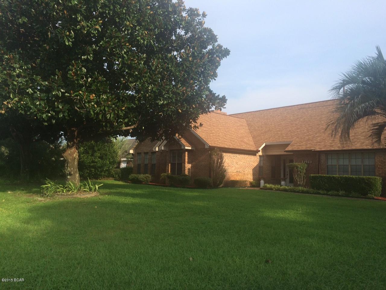 BACK ON THE MARKET!  This solid brick ranch on the west end of Panama City Beach is a real find, a home that you would love to call your own.  It has been meticulously maintained with a new roof this year.  The air conditioned sunroom allows light to flow through for your plants and the screened in porch is perfect for morning coffee or afternoon gathering of family and friends.  There is a fourth bedroom or study with bathroom that has its own separate entrance. It opens to the back yard.  The pool is oversized large enough to swim laps and the lawn is manicured presenting great curb appeal.