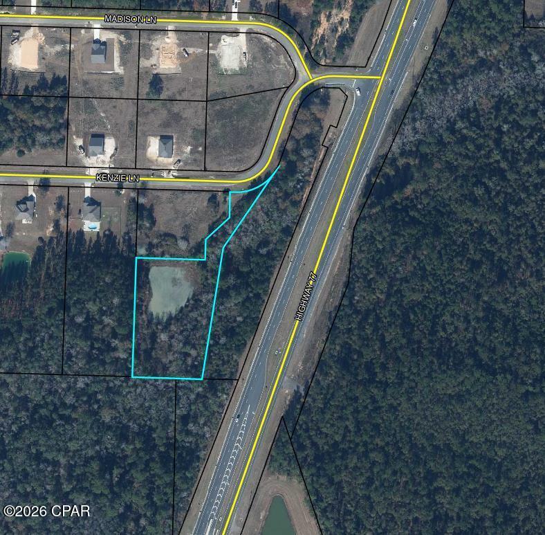 This exceptional 2-acre parcel offers a rare opportunity for strategic development or investment. Situated directly on the highly visible Highway 77 corridor, this property provides excellent accessibility and exposure, making it ideal for a variety of commercial, industrial, or infrastructural applications.

The parcel features an established retention pond, offering immediate utility for stormwater management, water storage, or environmental mitigation. Its prime highway frontage ensures seamless connectivity to the surrounding community and major regional routes, positioning it as a valuable asset for developers, municipalities, or investors seeking land with unique functional characteristics.

Whether you are looking to expand an existing operation, secure a water-management asset, or acquire a well-located parcel in a growing North Florida market, this property delivers exceptional potential. Don't miss the chance to secure this versatile piece of real estate in a prime location.
All measurements are approximate and must be verified by buyer