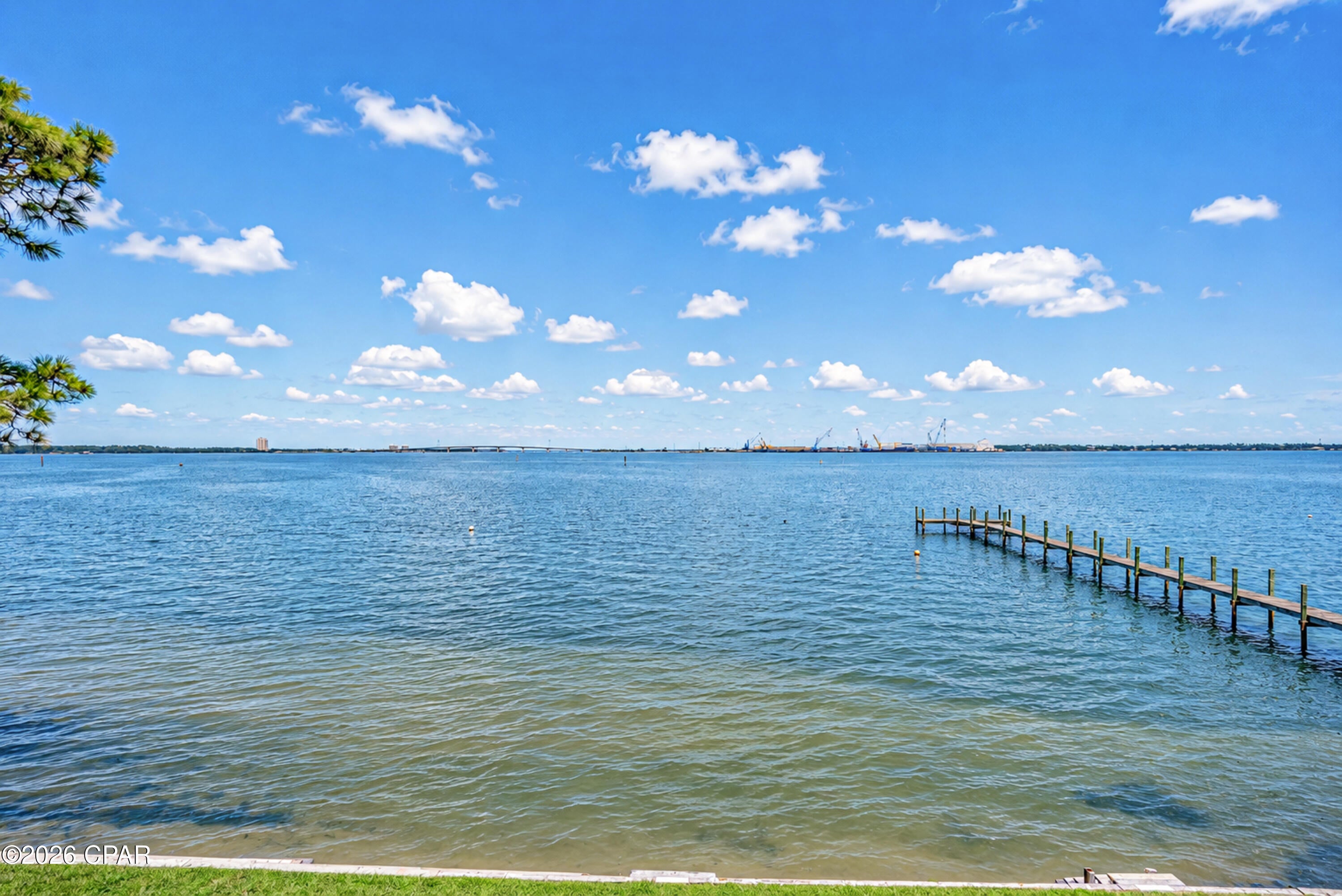 **LIVE WHERE THE BAY MEETS THE GULF.** Welcome to 2330 Pelican Bay Ct, an exceptional waterfront townhome offering an elevated coastal lifestyle with breathtaking views overlooking St. Andrews Bay and the harbor. Located in the desirable Pelican Bay community, this spacious 3-bedroom, 2.5-bath residence offers 2,357 square feet of beautifully proportioned living space, a private 2-car garage, and an extraordinary setting for those who appreciate life on the water.
From the moment you arrive, the peaceful waterfront setting makes an impression. Inside, the generous floor plan offers an effortless blend of comfort and sophistication, with spacious living areas designed to take advantage of the beautiful surroundings. Natural light fills the home while the bay and harbor views create a stunning backdrop for everyday living.
Step outside and embrace the boating lifestyle that makes this property truly special. **St. Andrews Bay provides access through St. Andrews Pass to the Gulf of Mexico and Shell Island**, putting some of the area's most beautiful waters, beaches, and boating destinations within easy reach. For boat owners, convenience doesn't get much better--you can **keep your boat right outside your unit on an anchor buoy**, and the community's **private dock provides a convenient place to load and unload** before heading out on the water.
Imagine starting your morning with coffee overlooking the bay, heading out by boat for an afternoon at Shell Island, then returning home to enjoy the sunset from your waterfront porch. This is coastal living designed around the water.
The spacious primary suite provides a peaceful private retreat, while two additional bedrooms offer flexibility for family, guests, a home office, or hobbies. Thoughtful improvements provide added comfort and peace of mind, including a new roof and porch in 2019, AC and water heater replaced in 2020, new dishwasher in 2021, and fresh exterior paint completed in 2026.
A **2-car garage** adds exceptional convenience and storage for vehicles, bikes, paddleboards, beach equipment, and everything needed to enjoy the Florida coastal lifestyle.
Beyond your doorstep, Pelican Bay offers a welcoming community atmosphere with a **clubhouse and pool**, providing the perfect place to relax, entertain, or spend a sunny afternoon close to home. The HOA fee is $1,713 semi-annually. Rentals are permitted with a minimum one-year lease, creating a desirable residential atmosphere while offering flexibility for those seeking a full-time residence, second home, or long-term investment.
And the location puts you close to everything that makes Panama City Beach special. Enjoy the sugar-white beaches and emerald waters of the Gulf, along with outstanding restaurants, shopping, entertainment, fishing, boating, and outdoor recreation--all while coming home to the peaceful beauty of your own waterfront retreat.
**2330 Pelican Bay Ct is more than a home--it's a front-row seat to the water, a gateway to the Gulf, and an invitation to experience Panama City Beach at its finest.**