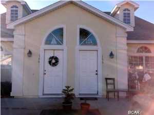 Palm Cove is a community located within a minute drive to Front Beach Rd and the Gulf. This 3 bedroom 2.5 bath home has a Master Bedroom on the first floor with a private bath and the other bedrooms are upstairs. Wonderful open floor plan with all appliances in the kitchen and laundry room . This is a great vacation home, investment property or permanent resident.