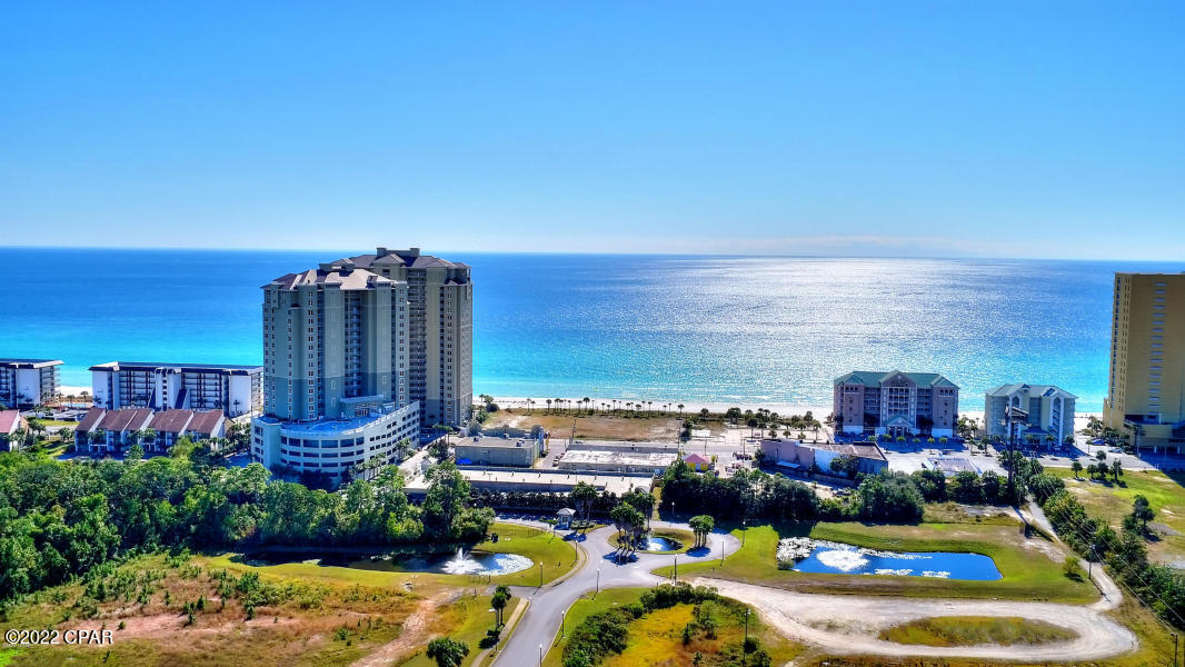 High floor unit with great view of The Gulf of Mexico. Master Bedroom has walk-in shower featuring floor to ceiling wall tile.. Bunks in Hall next to second full bath. Sleeps 6, could make a great short term rental. Grand Panama features two pools, gym, covered parking, and is one of the last condos completed on the beach. Unit is sold fully furnished.