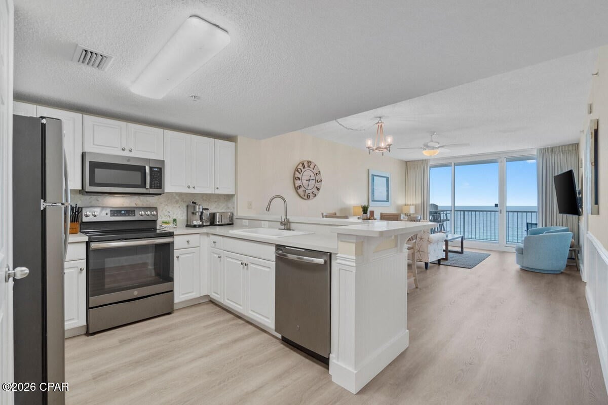 Welcome to Majestic Beach Resort Tower 1, Unit 1103--A beautifully updated 3-bedroom Gulf-front condo offering the beachfront lifestyle today's Panama City Beach buyers are looking for. Strong HOA with low quarterly dues! Perfectly positioned on the 11th floor, this residence delivers sweeping Gulf views from a comfortable, livable height--not too high, not too low--with direct balcony access from both the living area and Gulf-front owner's suite. And, it is so pretty!!
Inside, the condo feels fresh, coastal, and rental-ready, with recent improvements that include luxury vinyl plank flooring, wall baseboards, full interior paint, upgraded lighting fixtures, and kitchen backsplash. There are quality furnishings and a new couch, chair, and living room curtains. Big expenses are done; 2024 HVAC system, 2022 water heater, and newer stainless appliances. The result is a clean, stylish beach retreat that is easy to enjoy from day one. The open living area offers plenty of seating, a queen sleeper sofa, coastal decor, and an effortless flow to the private balcony overlooking the sugar-white sand and emerald water. The Gulf-front owner's suite features a king bed, balcony access, soaking tub, and a walk-in shower. Guests will appreciate the queen guest bedroom with access to the second full bathroom, plus a third bedroom with bunk beds--creating flexible sleeping space for families, friends, and vacation rental guests. Maximum guest occupancy is 7. Majestic Beach Resort remains one of Panama City Beach's most recognizable Gulf-front destinations, offering the kind of amenity package that helps properties stand out in a more selective condo market. Owners and guests can enjoy multiple Gulf-front outdoor pools, indoor heated pools, hot tubs, a kiddie pool, direct beach boardwalks, beach services, a poolside Bar & Grill, market and cafe options, fitness center, tennis and pickleball court, game room, movie theater, owner lounge, covered parking, and 24/7 security. The location is equally appealing: set directly on Front Beach Road in the heart of this seaside town, Majestic offers easy access to dining, shopping, entertainment, family attractions, sport fishing, local events, and the vibrant Pier Park corridor. With approximately 27 miles of beaches, year-round vacation demand, this area continues to attract visitors seeking a true beach getaway.
Whether you are searching for a turnkey beach getaway, a short-term rental opportunity, or a second home with resort-style amenities, Majestic 1-1103 delivers the views, updates, and location wanted most. Inquire about a Cost to Own Estimate to see how rental income helps offset ownership costs.