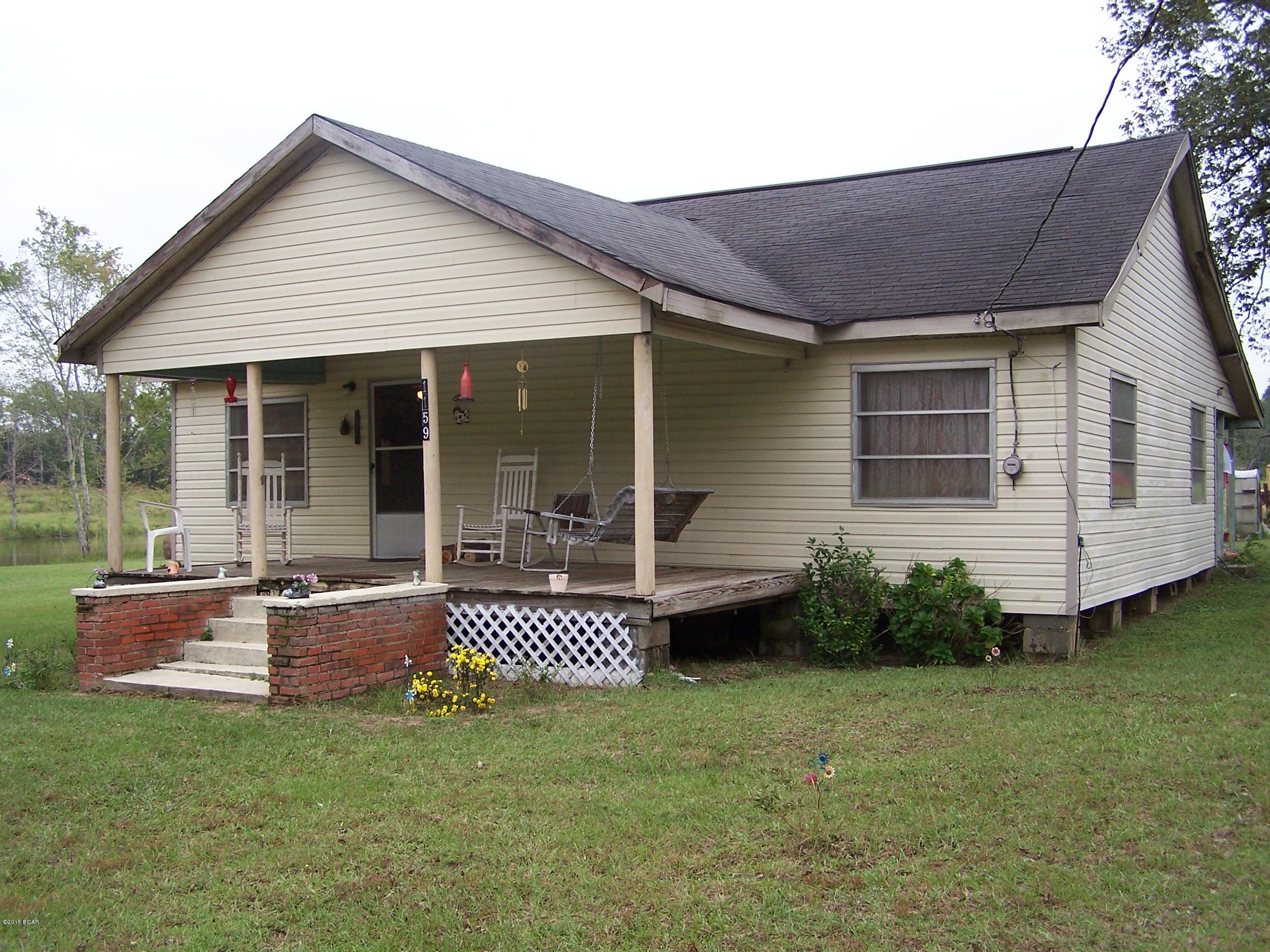 Great Hobby Farm with PERFECT Country Living. This gently sloping farm offers outstanding views from the Country Farm Style Home's open porches while nicely shaded by the Grand Oaks in the yard. Over 26acs of high dry land excepted for the beautiful half acre fully stocked Pond. Whether its horses, chickens, cows or any other Farm Animals this piece of Heaven will accommodate it.