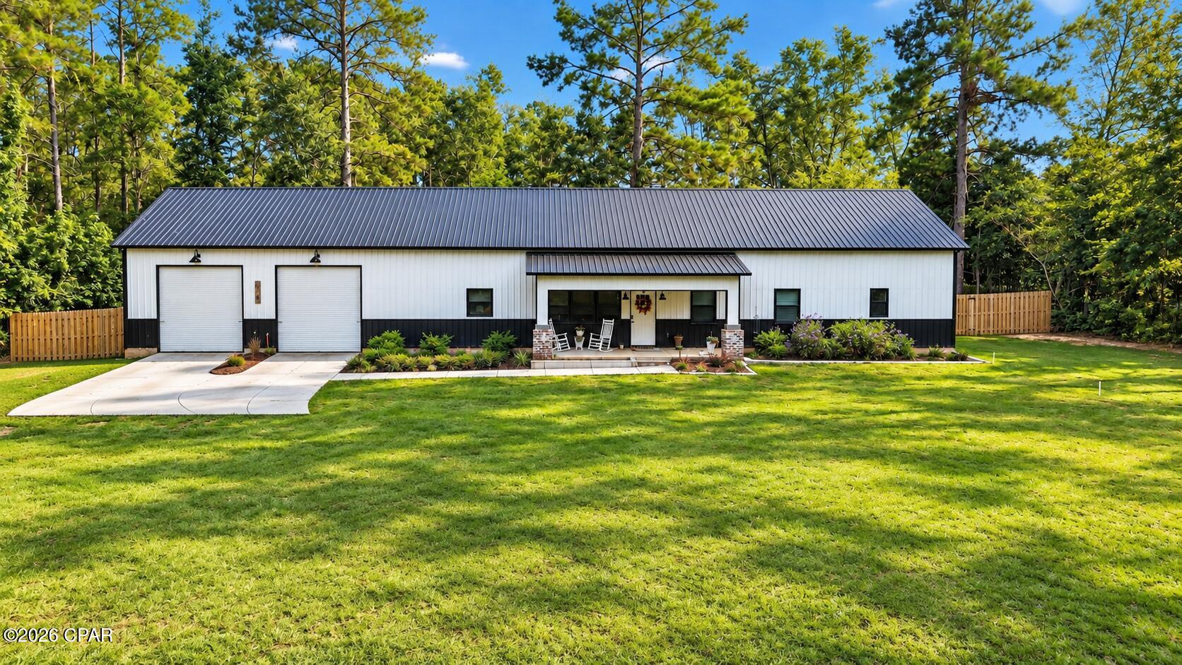 Built in 2024, this stunning 4-bedroom, 3.5-bath barndominium in Havana, Florida offers modern finishes, plenty of space, and a layout designed for both everyday living and entertaining.

Step inside to an inviting interior featuring LVP flooring throughout the main living areas, tile in the bathrooms, and a beautiful fireplace that creates a warm focal point for the home. The kitchen is a standout, featuring feathered granite countertops and a spacious butler's pantry that provides additional storage and prep space while keeping the main kitchen clean and organized.

The thoughtful floor plan offers four bedrooms and three-and-a-half bathrooms, giving everyone plenty of room to spread out. An attached two-car garage adds convenience and additional storage.

Outside, you'll find a spacious, well-maintained yard along with a fenced backyard that's perfect for kids, pets, or simply enjoying some privacy. The covered back porch provides a great spot for grilling, entertaining friends and family, or relaxing at the end of the day.

With its 2024 construction, modern finishes, barndominium style, and indoor-outdoor living space, this property brings together the character of country-inspired design with the comfort and convenience of a newer home. If you've been looking for something that's a little different from the ordinary, this Havana property deserves a closer look.