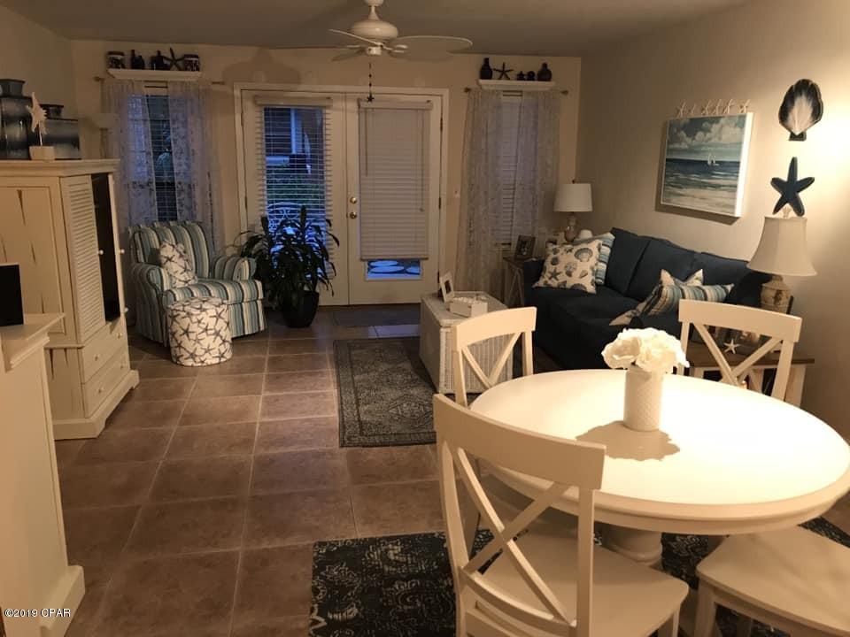 ***STUNNING TOWNHOME WITHIN WALKING DISTANCE TO ST. ANDREW'S BAY!!!*** This spacious 3BR/2.5Ba townhome features tons of natural light, an open concept living area w/ gorgeous tile, a downstairs master bedroom w/ ensuite bathroom, and newer back windows w/ French doors that open up to a lovely patio providing the perfect spot for your morning cup of coffee or grilling out. All appliances convey including the washer & dryer. New AC in 2014, new hot water heater in 2016, and new roof in 2017.  The low HOA fee covers the  groundskeeping for you as well as  garbage service. Seller is currently working with insurance to repair the minimal hurricane damage. Walk to the bay and enjoy our beautiful Florida sunsets! Must see this unit in-person to appreciate it. CALL TODAY!!