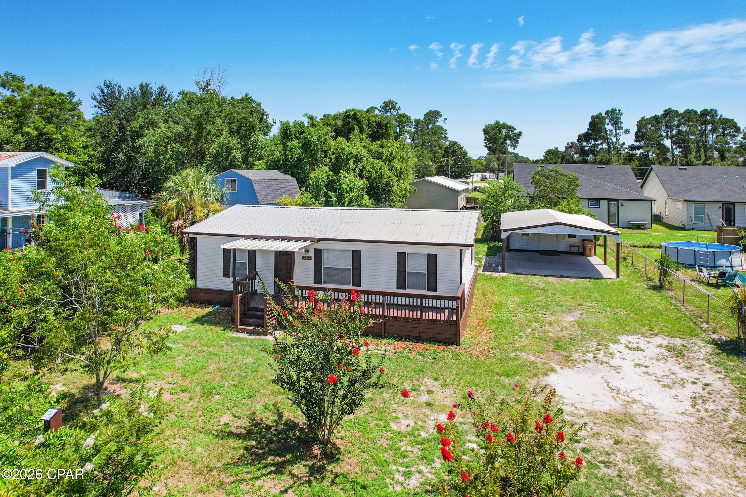 Charming 3-bedroom, 2-bath home on owned land in the heart of Panama City Beach! Situated on a spacious 75' x 135' lot, this well-maintained 1993 home offers just under 1,000 square feet of comfortable living space with no lot rent. Inside, you'll find a functional layout and a desirable gas stove in the kitchen--perfect for those who love to cook. Step outside to enjoy the fully fenced backyard, shaded by beautiful mature trees, featuring a spacious gazebo that's ideal for entertaining or relaxing, plus a large storage shed for all your tools and beach gear. Conveniently located just minutes from the beach, Pier Park, restaurants, shopping, entertainment, and all that Panama City Beach has to offer, this property is perfect as a primary residence, vacation home, or investment opportunity. Don't miss your chance to own this charming beach-area property!