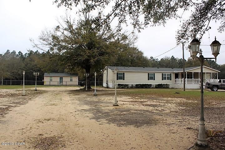 **Priced to Sell**Beautiful 4 Bed / 2 Bath,   Move in ready Home on 2 acres just outside Crestview. Inside features large rooms, walk in closets in the bedrooms, sheet rock walls, updated bathrooms  and working fireplace in the den. Outside features fenced back yard, 12X30 workshop, Covered patio and Large 14X24 porch across the front. Please call today to see this one before it is gone!