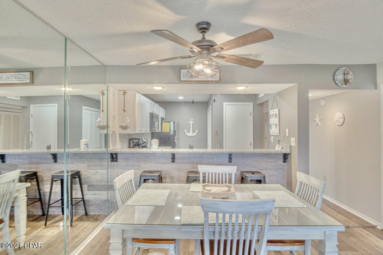 SHORT-TERM Rentals Allowed! Great CASH FLOW opportunity! This Luxurious Upgraded Edgewater Villa has been completely upgraded w/captivating furnishings & Modern/Beachy style! New LVP Flooring throughout (EASY CLEAN - NO CARPET); LVP Shiplap under Kitchen Bar; Polished Ceramic Subway Tile Backsplash; Granite Countertops; Stainless Steel Appliances; Luxury White Kitchen Cabinets; Freshly painted in light, beachy gray & brand new Furnishings, that makes this stand out from the rest!  Enjoy the private Balcony & Lake/Water views, soaking in the Gulf's Breeze! Spacious & Open Floor Plan & Walk-in Closets! Fully Furnished & Move In/Rental Ready! Plan your next VACA & Relax at the Beach, enjoy all of Resort Pools, Amenities, Local Restaurants & Shopping in Luxury & Style! YOUR Paradise Awaits! Exclusive Resort Amenities: Tropical Pools, Hot Tubs, Sun Decks, Beach Access. Restaurant, Room Service, Poolside Bar. Market serves Starbucks and Ice Cream. Everyone loves the Pizza Shop. Kids Club features Special Events, Splash Pad, Activities. At The Club owners play unlimited Golf, Basketball, Tennis and Shuffleboard. Enjoy the Fitness Center, Salon and Spa Services. Manned, Gated Entrances, 24-hr Security.