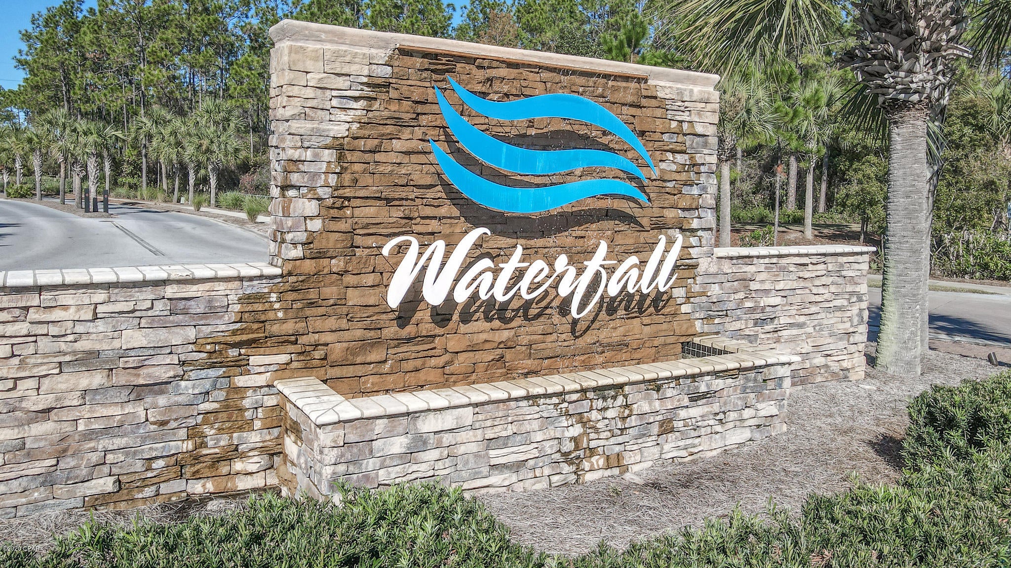 CURRENTLY UNDER CONTRACT, SELLER ACCEPTING BACKUP OFFERS.  A rare find within Waterfall, this town home is an end unit that offers a large, fenced in side and back  yard.  You will not find any other lot that compares.  Conveniently located close to shopping, schools, restaurants, and the beach that's just 1.3 miles away.  Tucked away and surrounded by conservation land.  All you have to do is put your toes in the sand, HOA takes care of the rest.  Inside you'll find stainless steel appliances, granite countertops, and vinyl plank flooring.