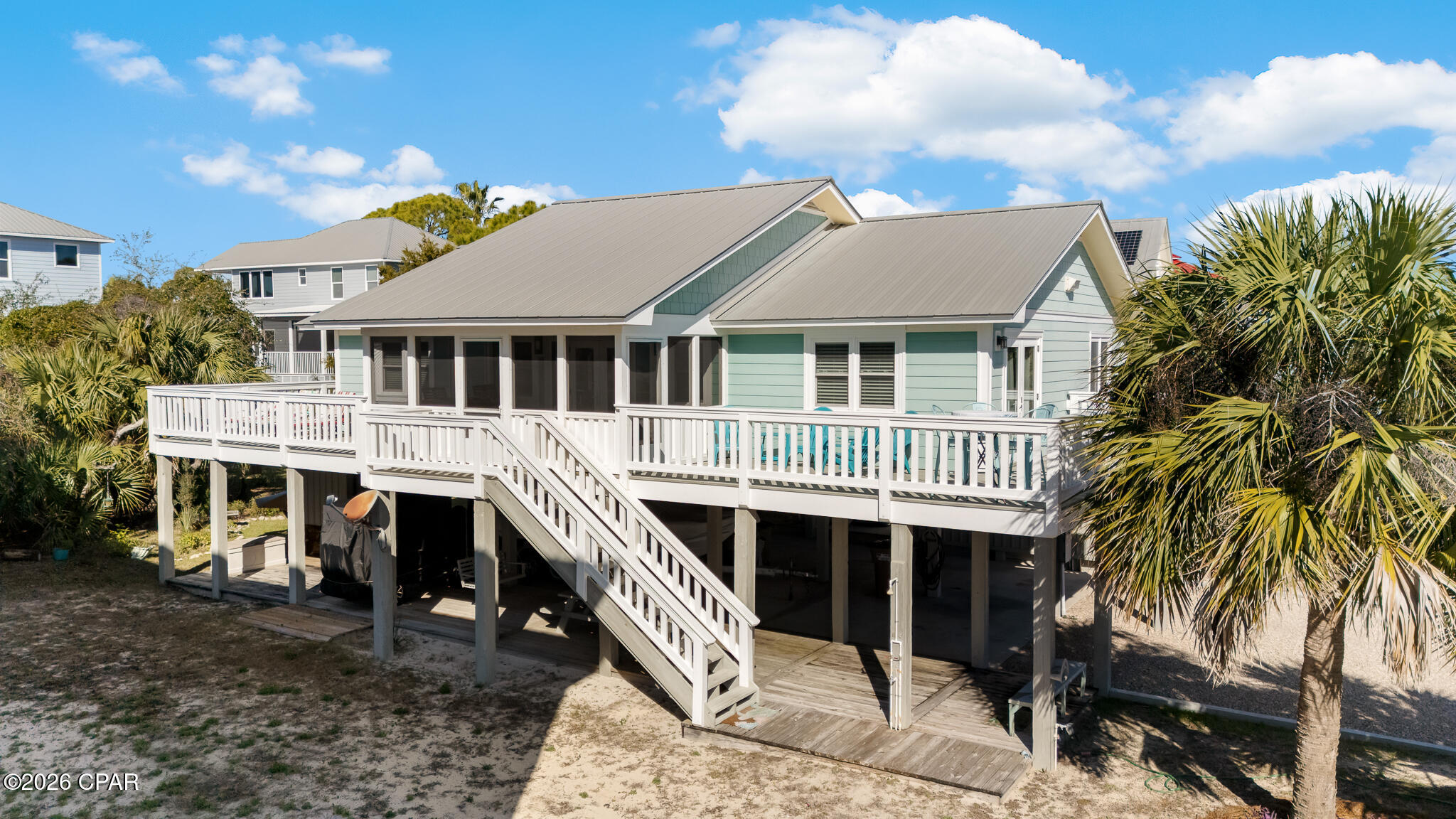 GREAT VIEWS! 4 BEDROOMS, 2 BATHS, 1344 HEATED AND COOLED SQUARE FEET. Rare 1st Tier Beach Retreat on Indian Pass - Where Gulf Breezes Meet Old Florida Charm. Wake to panoramic views of the Gulf and St. Vincent's Island Refuge from this exceptionally positioned 4-bedroom, 2-bath beach home. Built in 1986 and lovingly maintained, this coastal gem captures the essence of Old Florida living with modern-day ease. Inside, discover the warmth of authentic pecky cypress walls and soaring vaulted ceilings that fill the home with natural light and coastal character. The open-concept living area flows seamlessly into the kitchen with breakfast bar—an inviting space designed for gathering, entertaining, and savoring life at the beach. A thoughtfully designed split floor plan offers maximum privacy, with two bedrooms and a full bath on each side, separated by a hallway privacy door. Two bedrooms open directly onto the expansive deck, where morning coffee and sunset cocktails become daily rituals. Outdoor living takes center stage with a screened front porch accessed through French doors, generous storage for all your beach gear and water toys, a refreshing outdoor shower, and a spacious carport deck. The landscaped backyard provides a peaceful retreat, while the durable metal roof and Hardie-plank siding ensure worry-free coastal living for years to come. Nestled in the pet-friendly, golf-cart community of Indian Pass, you're moments from pristine beaches, the serene lagoon, and the unspoiled natural beauty of St. Vincent's Wildlife Refuge. Enjoy convenient access to shopping and dining in nearby Port St. Joe and historic Apalachicola, plus the legendary Indian Pass Raw Bar practically in your backyard. Whether you're seeking a full-time coastal sanctuary or the ultimate vacation escape, this rare beachfront opportunity offers the lifestyle you've been dreaming of, beautiful beach, nature, fishing, boat launch two miles away, and your own slice of Florida's treasured Forgotten Coast.
2025