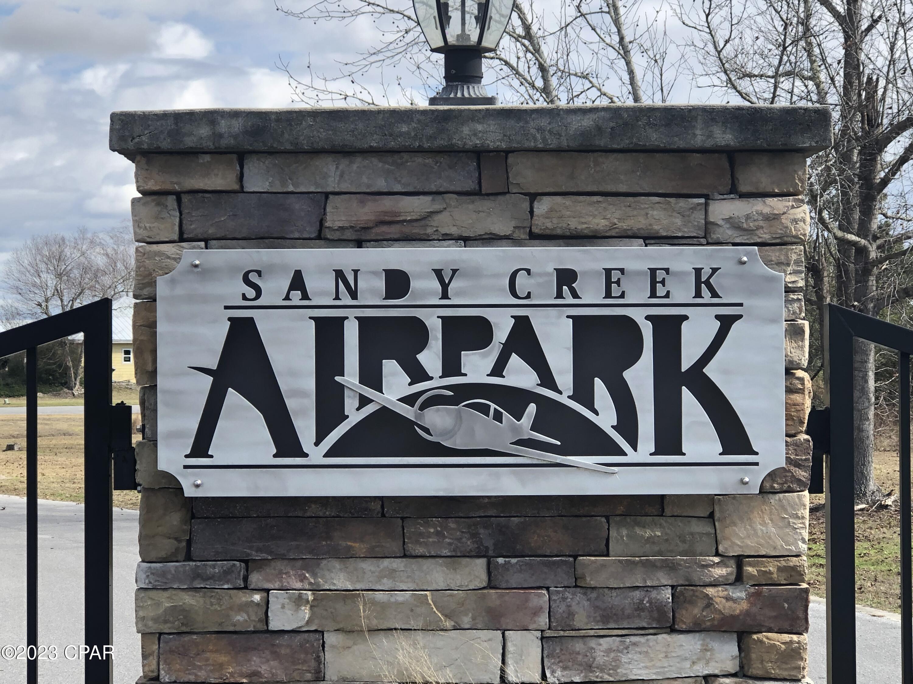 Welcome to Sandy Creek Airpark! A gated residential airpark community that features a 3,200 ft. paved runway, with lights and a beacon for night operations. The large cleared lots are big enough to build your custom dream home with a private hangar. This runway lot features direct taxiway access to the runway. The very low HOA dues maintain the common areas(runway, roads, taxiways and easements). The FAA airport designator is 75FL located on the New Orleans sectional chart. This is a gated community. Please contact the listing agent to see property. Don't miss this opportunity.