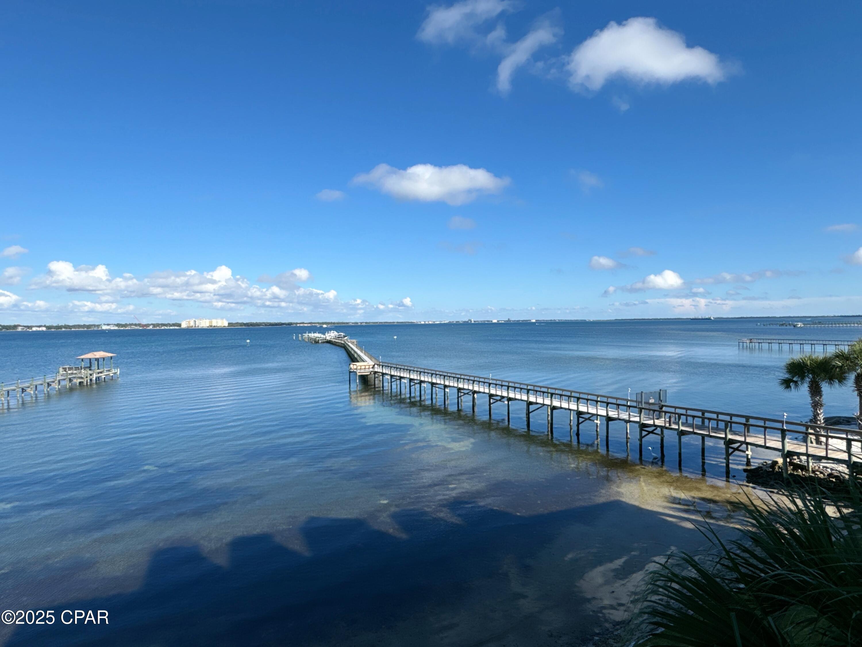 CURRENTLY UNDER CONTRACT, SELLER WILL CONSIDER BACKUP OFFERS..... DOCK #5 WITH LIFT INCLUDED WITH PURCHASE.   This is a beautiful condo, in pristine condition.   3 Bedrooms with 2 full baths plus a 1/2 bath.  Large balcony with PANORAMIC BAY VIEWS.   Lots of out-door living space.   VIKING APPLIANCES WITH GAS COOKING.   SUBZERO FRIDGE.   Primary Bedroom is Bay Front.   Easy to show, come and see for yourself.