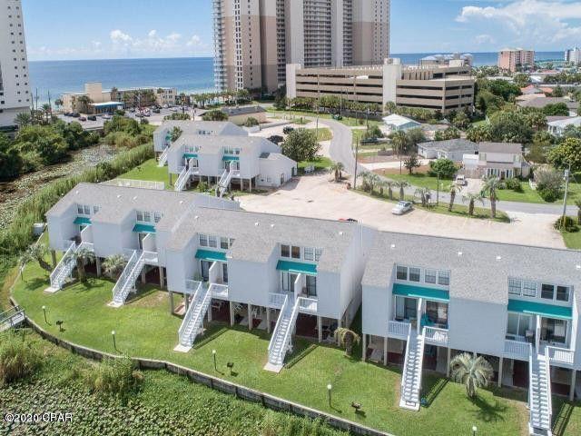 'CURRENTLY UNDER CONTRACT, SELLER ACCEPTING BACKUP OFFERS' Like BRAND NEW ground-level condo fully updated with modern finishes just 1/2 block from beach on the popular west end of Panama City Beach! Enjoy beautiful lake views from your private patio! You really can have it all here and not break the bank! This studio is perfect for a second home, vacation rental, or for affordable long term efficiency living! Lullwater Lake Beach Condominiums complex is low density so No elevators! Owners have ample parking and love their pool, bbq grills, new private dock. This unit comes with a bright white farmhouse chic kitchen, granite counters, tile floors, updated bathroom vanity dishwasher, refrigerator, stove, lovely dining area, open concept living, and comes completely finished!