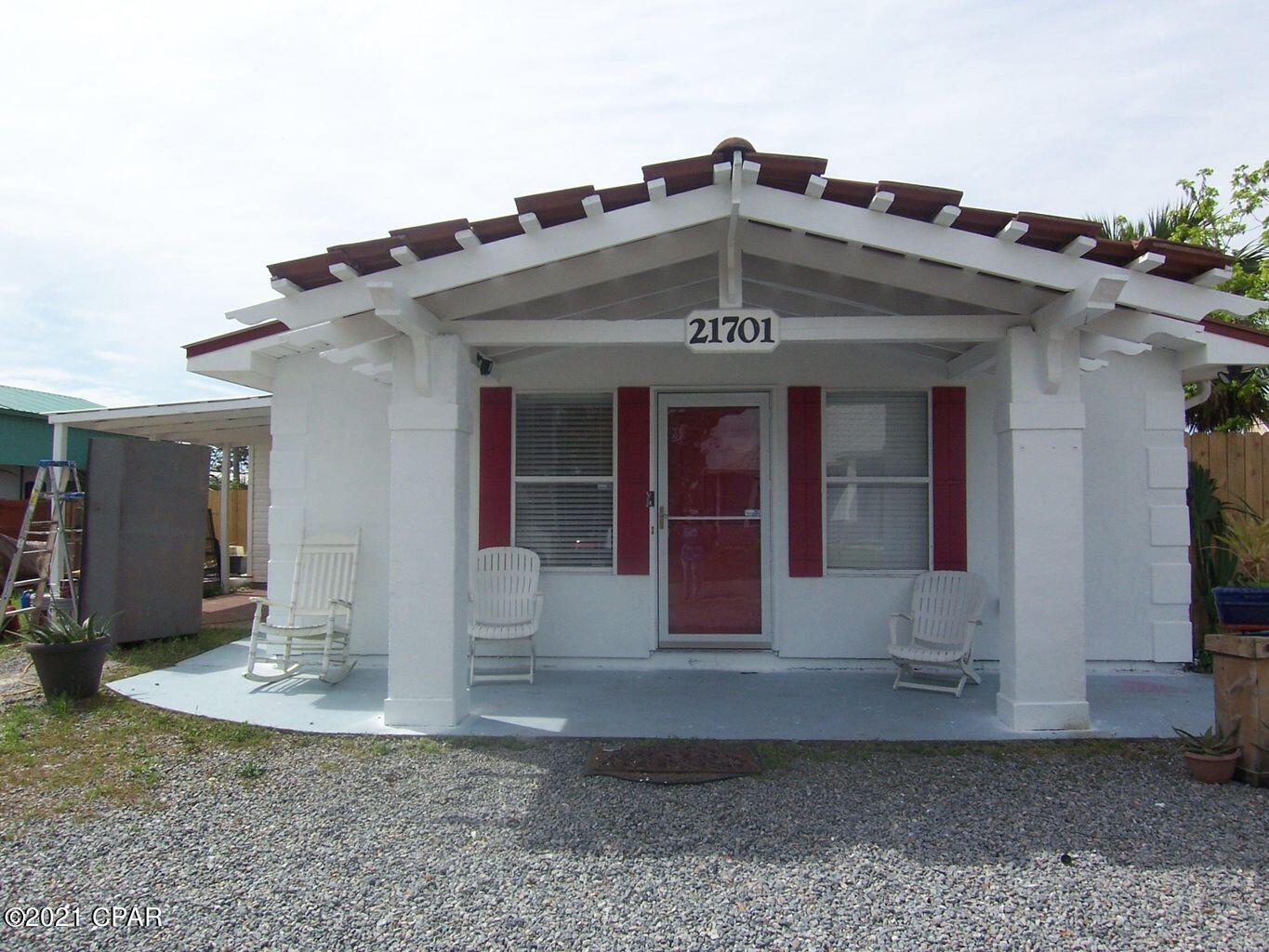 House on TWO LARGE FENCED  LOTS!- Room to add pool and large garage or increase for more square footage. Beautiful neighborhood. Walk or take golf cart to Beautiful West Beaches. Owners can park Golf Cart at Access 87 across from beach.

''New Roof and Air/Heat and septic were added 7 years ago.-  easy to show!
