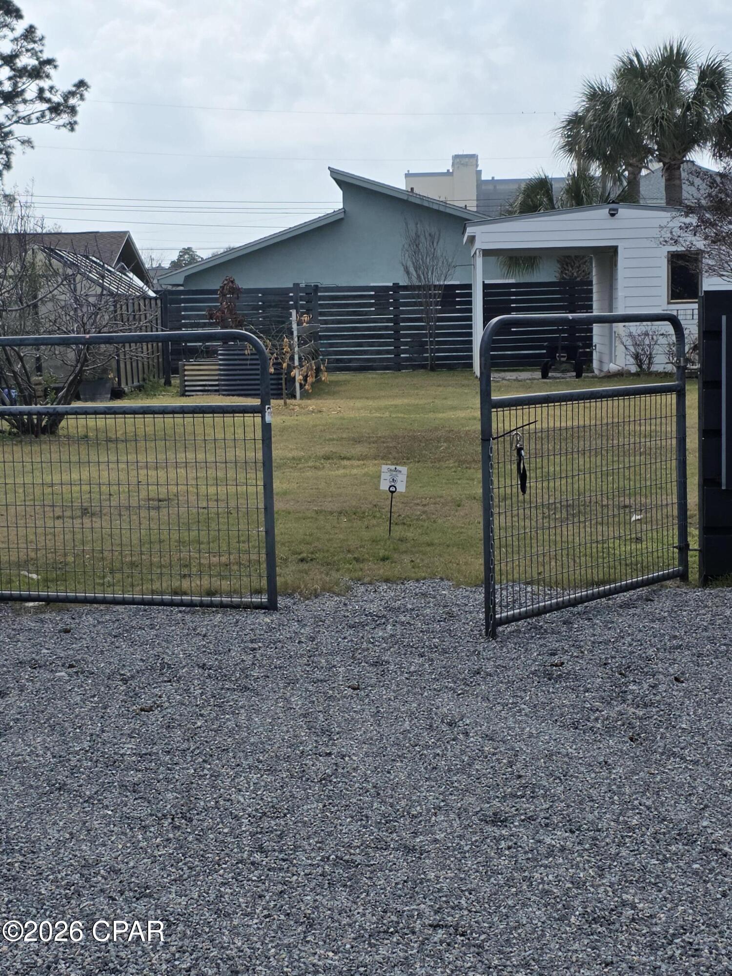 Welcome to the rare opportunity to own a premier building lot in Panama City Beach's sought-after South Lagoon neighborhood! Perfect for developers, builders, or anyone dreaming of a custom water view home.  This lot is walking distance to two public lagoon access points.  One access is 'Dolphin Drive' boat ramp which features a dock (for fishing) and public parking.  This area is ideal for boating enthusiasts. Situated directly on S. Lagoon Drive with beautiful water glimpses and golf cart-friendly charm.  Jump in your golf cart and only a couple of blocks to Gulf Beach Access,  top restaurants, lively bars, and PCB attractions.  South Lagoon area is a short drive to St. Andrews State Park (fishing pier, nature trails, snorkeling) and Navy Support Center. This unbeatable location offers relaxed coastal living with easy access to everything that makes Panama City Beach special--don't miss your chance to build in one of Florida's most desirable communities!
