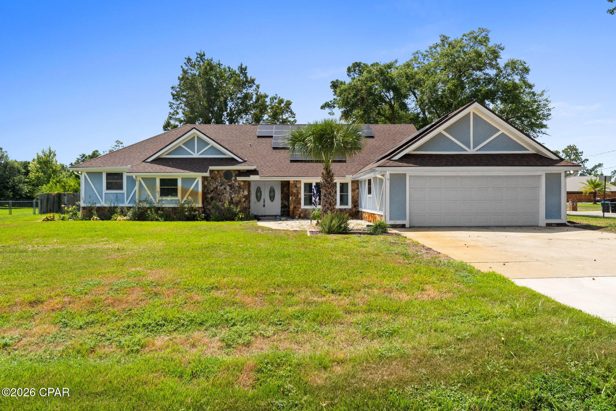 'CURRENTLY UNDER CONTRACT, SELLER WILL CONSIDER BACKUP OFFERS' Welcome to this incredible 4-bedroom, 2-bath home offering 2,484 square feet on a sprawling half-acre lot in the highly desirable Kings Point neighborhood. Priced to sell, this property combines space, location, and exceptional outdoor living. Inside, a bright and open living room features soaring vaulted cathedral ceilings and flows seamlessly into a large kitchen perfect for cooking, entertaining, and gathering with family and friends. The home offers spacious, well-appointed bedrooms, a two-car garage, and a large driveway with plenty of parking. Outside, the backyard truly sets this property apart with a beautiful pool resurfaced in 2023, mature landscaping, an expansive yard, and an impressive 20' x 20' like-new storage shed offering an incredible amount of additional storage and versatility. With its half-acre lot, pool, generous living space, oversized shed, beautiful backyard, and sought-after Kings Point location, this home offers tremendous value and is a smart buy in one of Panama City's most desirable established neighborhoods.