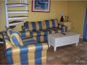 Fully furnished condo on the 3rd floor. Unit has a sprial staircase leading to the loft-style 2nd bedroom. Balcony overlooks the complex pool and Grand Lagoon.