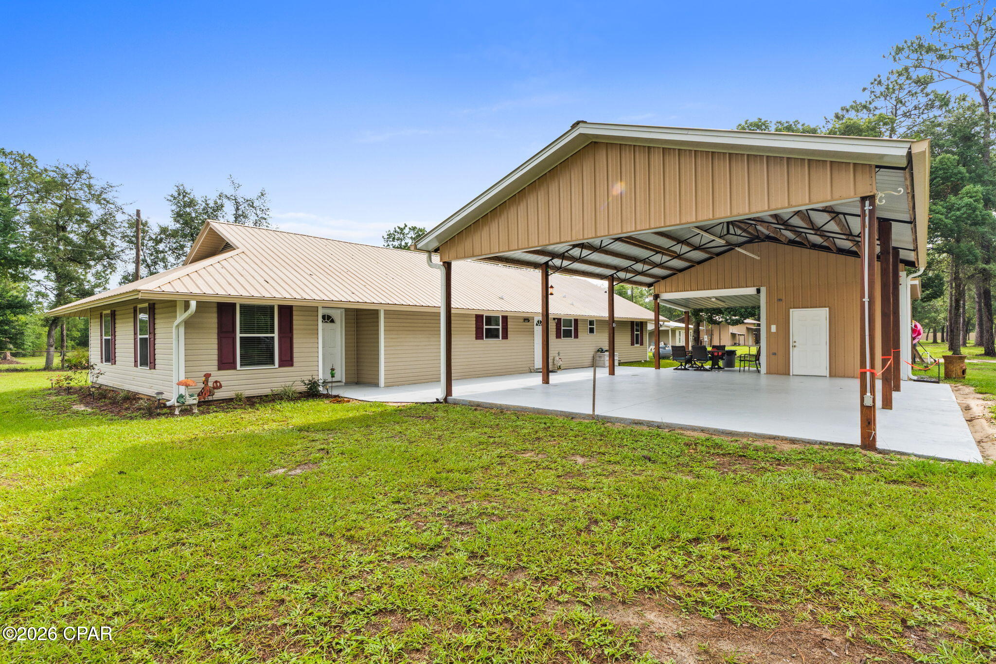 Welcome to your private slice of country living at 13816 Fiddlers Green Rd--an exceptional multi-use property set on 2.5 acres, featuring a spacious main home built in 1981 with additions and renovations in 2016 and 2026. A fully equipped apartment, and an incredible workshop setup you won't find anywhere else.

The main residence offers warm, comfortable living with an inviting layout, large living room with tray ceilings, and a charming galley-style kitchen with abundant cabinetry, solid surface countertops, and a walk-in pantry. Multiple living and dining spaces make this home ideal for entertaining or spreading out. The main house is 3 bedrooms, 2.5 baths 2044 sqft. The second bath has a jet tub.

Tucked just steps away is a separate apartment--perfect for multigenerational living, guests, rental income, or a private home office. With its own full kitchen, living area, bathroom, and laundry space, it's truly move-in ready. Apartment is 2-bedroom and 1204 sqft.

Outside is where this property becomes something truly special. A massive pole barn with loft provides outstanding workspace, storage, and hobby potential. Whether you're a craftsman, mechanic, boater, or outdoor enthusiast, this setup checks every box. The barn includes enclosed workshop space, overhead storage, and multiple covered bays. An additional open-air storage garage offers even more room for equipment, trailers, RVs, or outdoor toys.

With plenty of cleared yard space, mature trees, and a peaceful rural setting, this homesite offers the perfect blend of privacy and functionality--all while still being within a short drive to town, schools, and amenities. The proposed paving of Fiddlers green is in the planning stages.

If you've been searching for land, flexibility, and endless possibilities, this property delivers it all. Schedule your private tour today.