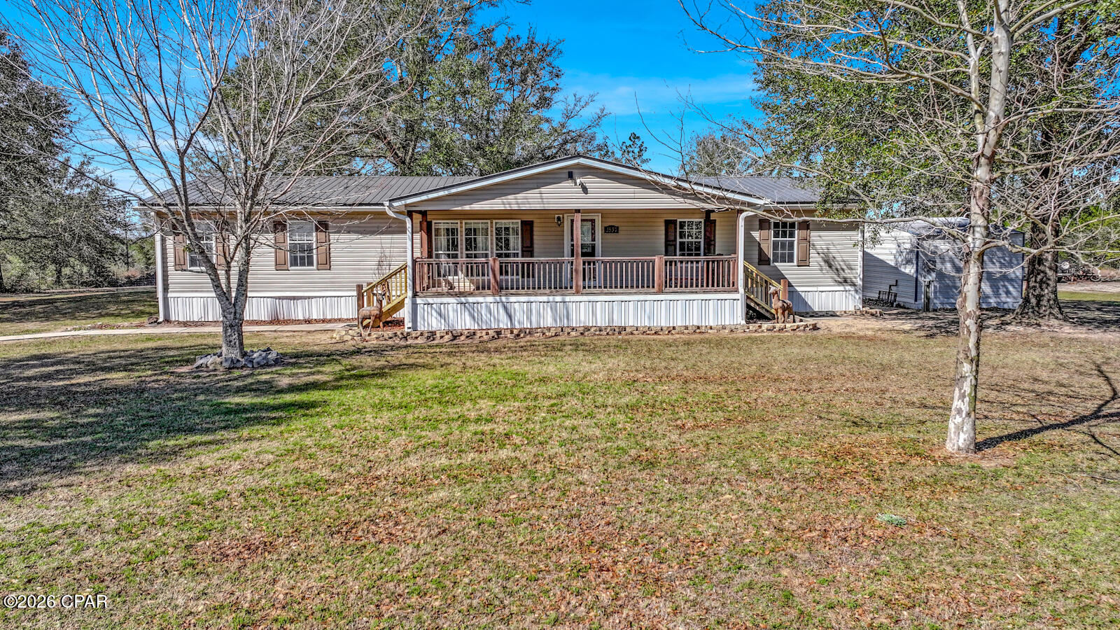 Situated on two peaceful acres, this property offers the comfort and freedom of country living with room to truly make it your own. The peaceful setting allows you to enjoy a slower pace while still having the space and functionality needed for everyday life.

The interior features a split floor plan designed for privacy and easy living. The spacious kitchen provides abundant counter space and a natural gathering area, making it ideal for both daily routines and entertaining.

A covered front porch adds to the home's charm, offering a welcoming place to enjoy morning coffee or relax in the evenings while overlooking the property.

The pole barn enhances the property's versatility, providing excellent space for storage, a workshop, hobbies, or equipment. With two acres to work with, there is ample opportunity to create the outdoor setup that fits your lifestyle.

For those seeking space, flexibility, and a peaceful setting, this property presents a wonderful place to call home.