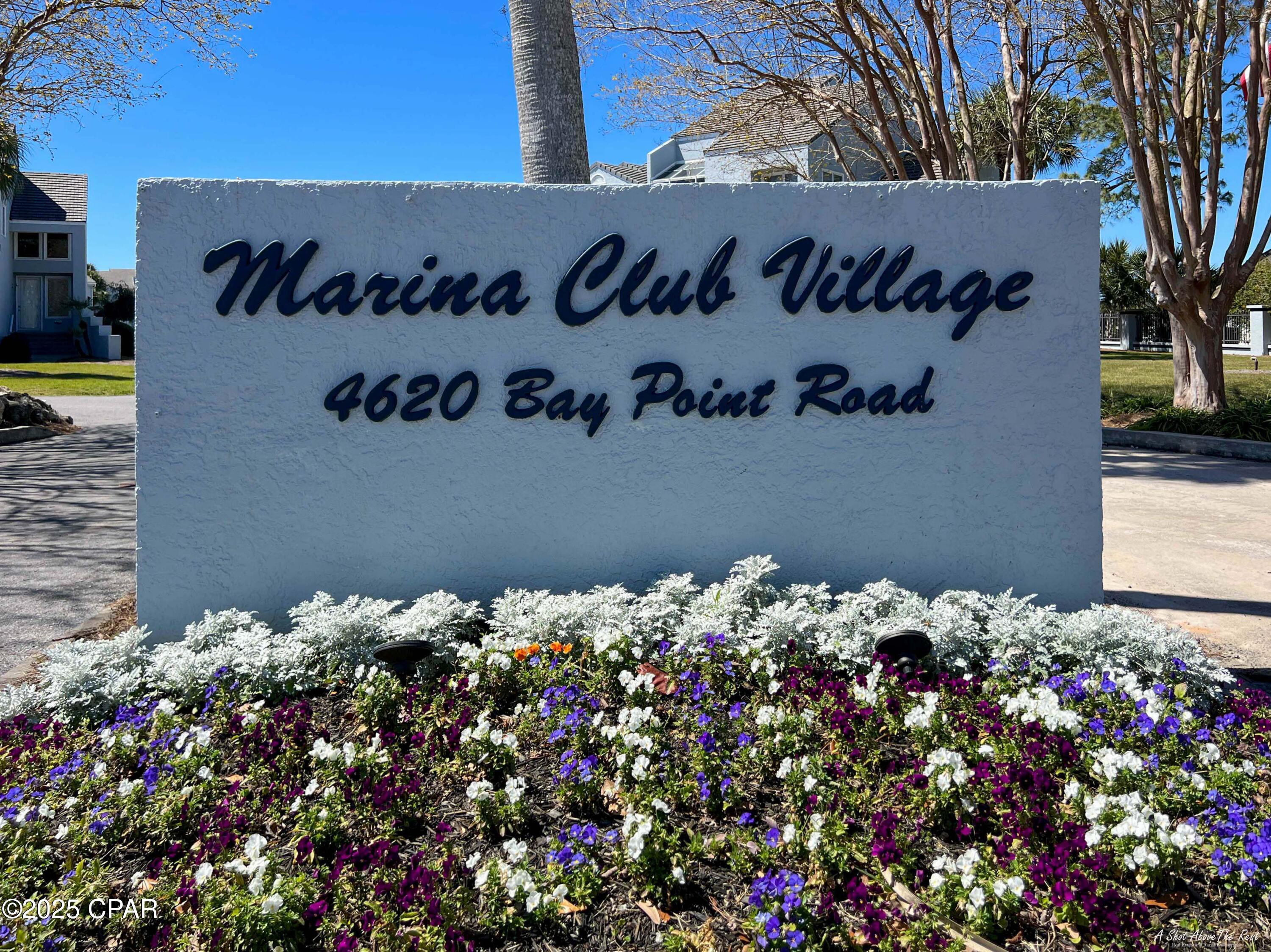 From your deck of this beautiful ground floor unit, enjoy the panoramic view of the Grand Lagoon teaming with  boat traffic cruising in and out of the marina and around the bay!  It's a short walk to the full service marina with all the yachts and nautical activities! Although the unit is tastefully decorated, the owner is offering $10,000 at closing so you can change the wall colors to suite your taste!  Located in Bay Point, a gated community featuring 3 restaurants, a championship golf course, clay tennis courts, 24 hour roving security, and our deep water marina just minutes from the Gulf of Mexico. Check out the Mercedes convertible and golf cart in the garage and say, ''let's make a deal''!