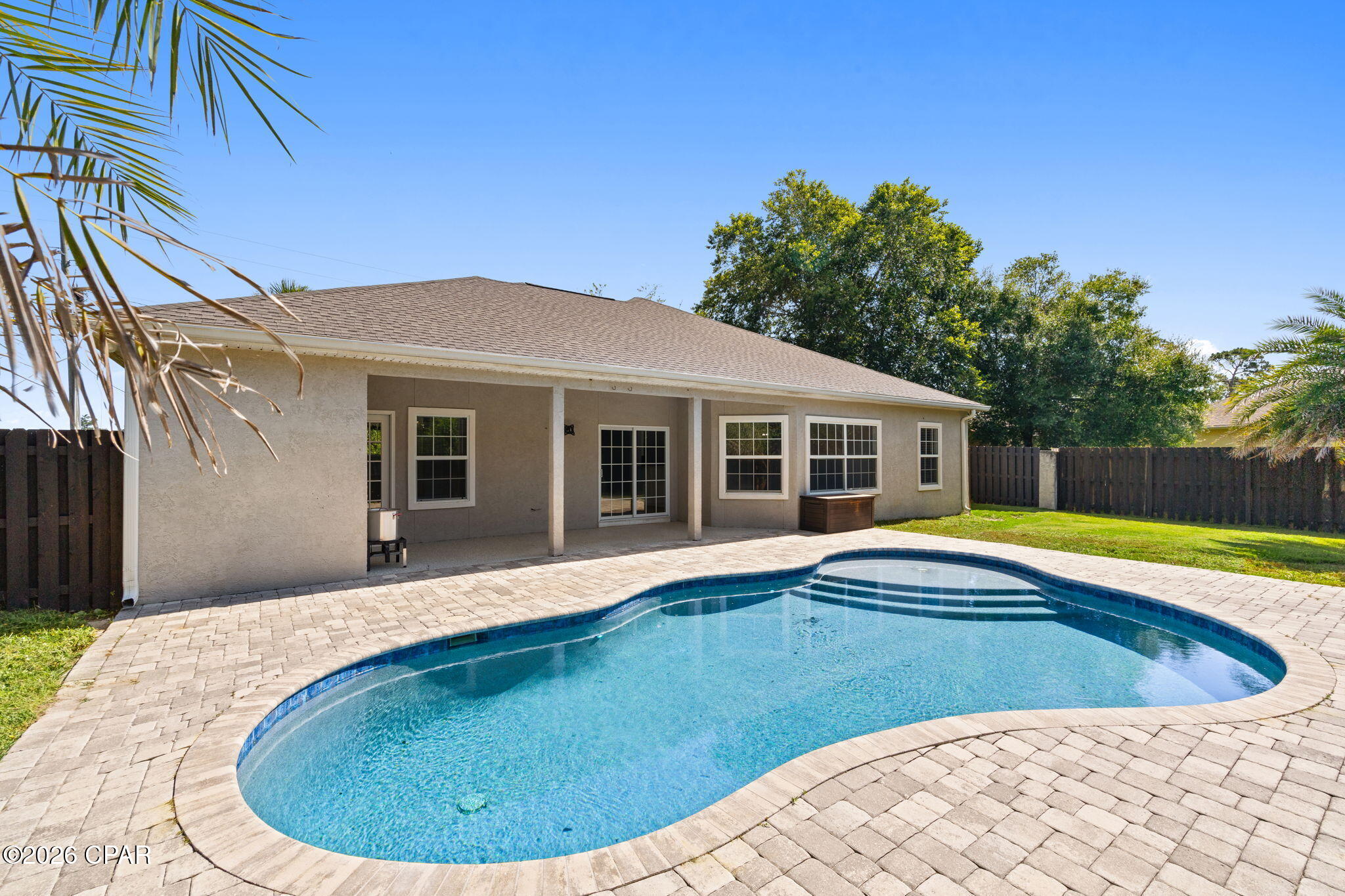 **UNDER $500K IN PANAMA CITY BEACH -- WITH A PRIVATE POOL! NOW $499,999!** Welcome to 4601 Magnolia Beach Road, a beautifully maintained 3-bedroom, 2-bath home in Magnolia Point at The Preserve offering comfortable single-level living, valuable updates, and a backyard that immediately sets it apart.

Inside, you'll find a spacious living room with a cozy gas fireplace, a formal dining area, and a generous kitchen with a breakfast bar and adjoining breakfast nook. The oversized primary suite features waterproof composite flooring, a large walk-in closet, an en-suite bath with a whirlpool tub and separate shower, plus direct access to the backyard.

Step outside and the real showstopper comes into view: a private saltwater pool installed in 2021, surrounded by a large covered patio and fully fenced yard. Whether you're relaxing, entertaining, or simply enjoying Florida sunshine at home, this backyard delivers the kind of outdoor living buyers are searching for.

Major updates add even more value and peace of mind, including a 2025 Hisense high-efficiency HVAC system, 2020 roof, 2020 gas water heater, 2025 pool pump, refrigerator and range from 2021, dishwasher from 2024, washer from 2025, and dryer from 2021.

Conveniently located just minutes from the Navy base, marinas, shopping, dining, and the white sandy beaches of Panama City Beach, this move-in-ready home offers an exceptional combination of location, condition, outdoor living, and value.

At **$499,999**, this home is now positioned below the $500K mark and deserves immediate attention. If you've been waiting for a well-maintained Panama City Beach home with a private pool, single-level living, and major updates already completed, this is one you do not want to miss.