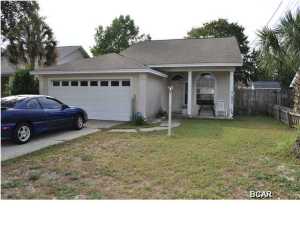 You can walk to the beach from this Open Sands home. Great home for a small family or retirees looking to downsize. The interior of the home boasts an open-floor plan with raised ceilings, wood laminate flooring in the kitchen,and a charming screened porch. The backyard is privacy fenced, perfect for your four-legged family members and there is a garage. Not only are you close to the beach, you're just minutes from Pier Park, schools, golf courses and more! All info is approx. and must be verified by Buyers if important.