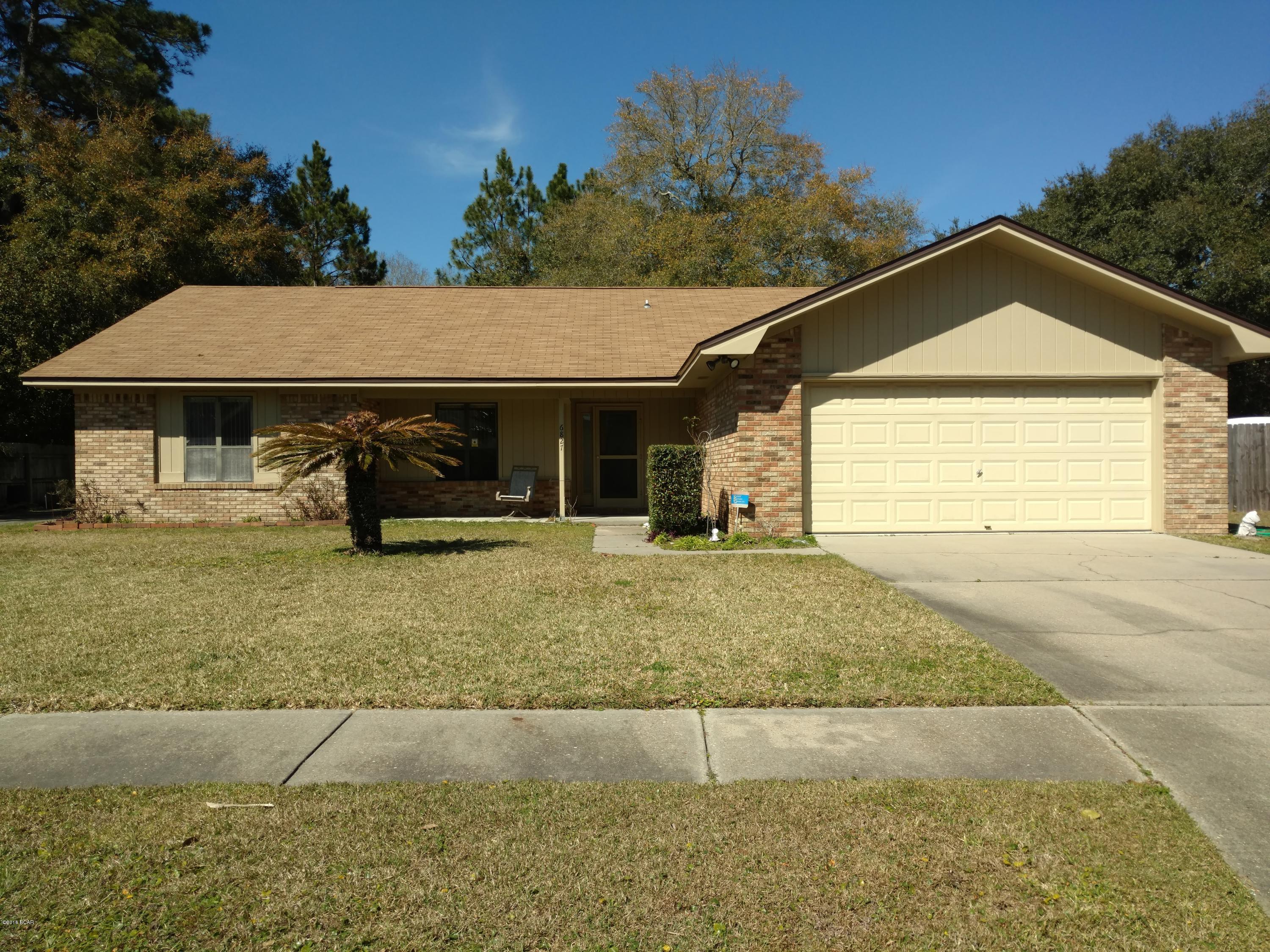 SPOTLESS-A MUST SEE! ONE OWNER! All Brick-new paint. Priced below assumed appraised value for immediate sale. One Year Home Warranty! Cathedral ceilings & fireplace in large living room flooded w Natural light by skylights- replaced and resealed. Diningroom off kitchen, separated by large bar. Large, sunny kitchen with Island-great for food prep. Appliances in VGC. Immaculate commercial grade Washer/Dryer. This Bayfront neighborhood is very popular with Air Force families-mins to Base. Prevailing breezes make this home a delight. Open the front & rear screen doors and you won't have to rely on AC as early as other homes. 2 concrete driveways, one to double fenced back yard other to oversized garage. Huge back yard. Under roof back porch & exit from Master w/Walk-in Closet & Walk in shower.