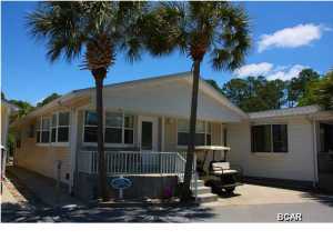 Rare opportunity to own a Venture Out home that backs up to St. Andrews State park. This great home features an open floor plan. With 3 bedrooms and 2 baths there is room for everyone. The home has just had the interior repainted and the carpet was replaced within that last year. Possible owner financing is also available with agreeable terms. Just bring your swimsuit and get ready to relax. Venture Out is a golf cart community that has 300' on the beautiful pristine beaches of the Gulf of Mexico and 1,000' on the Grand Lagoon. Venture Out has something for everyone. With two salt water pools (one heated), fishing pier, boat ramp, mini golf, children's play ground and much more. All measurements are approximate.