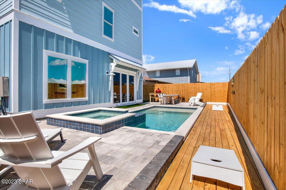 Back on the market with new rental company! New Construction, 7 bedrooms, 7 baths, on east end just across the street from Gulf with great Gulf views and public access just 50 yards away from front door. Our best rental plan, sleeps 18 The house is a fully furnished Beach House is designed to be a rental machine. Income models area available and already on rental program. Upon entering the home from the front door, the first two bedrooms are located to the left and to the right. Both bedrooms feature a large king bed with 2 twin beds and their own private en-suite each with a walk-in shower. Leaving the bedrooms, the hallway leads to an open living area with a large TV, shuffleboard, foosball game and wet bar. This living space features a sliding glass door that takes you to this home's private backyard area which features a fully furnished outdoor deck with lounge chairs and a dining table, a private heated pool, and a charcoal grill. The first floor is also home to a half bathroom and the 1st washer and dryer set. Going up to the 2nd floor is the main living room, dining room, fully equipped kitchen with an eat-in-bar, and another wet bar for your convenience. On this floor, there are two more bedrooms, each one featuring a large king bed and a private en-suite with walk-in showers. There's a furnished walkout balcony off the main living room which offers a great place to relax and enjoy the views. There is also a half bathroom located in the hallway on this floor.  On the 3rd and final floor, there are the three remaining bedrooms. Two of these bedrooms have a king bed and private en-suite with walk-in showers. This next bedroom you'll want to be quick to claim! Towards the frontside of the home is the luxuriously styled master suite with a large king bed, a private walkout balcony with great views, a private en-suite with double vanities, large soaking tub, and walk-in shower. The 2nd laundry room is also located on the 3rd floor.