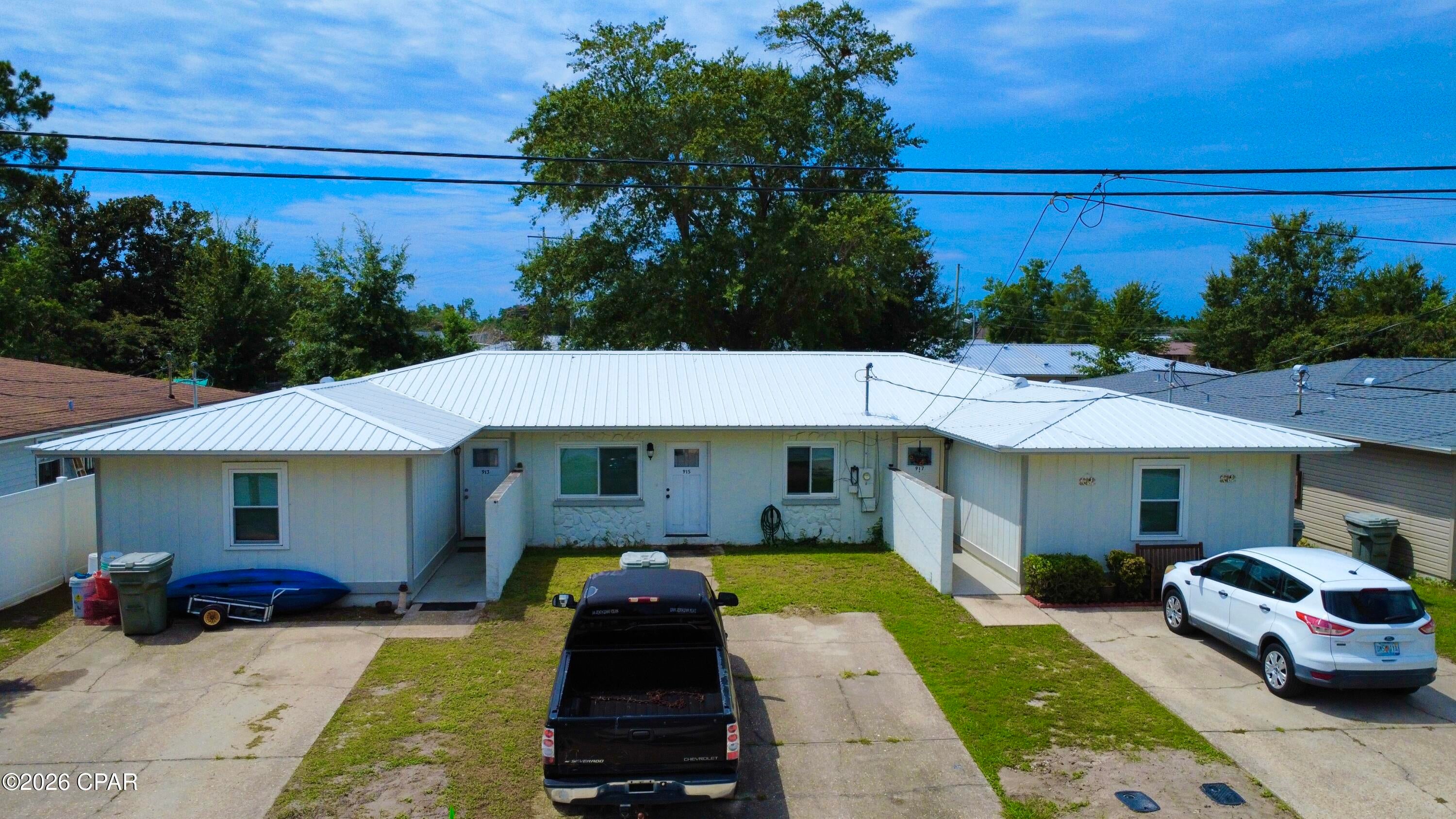 Discover a rare gem in this triplex located in Lynn Haven, Florida. 913, 915, 917 Bradford Circle presents an outstanding investment opportunity with immediate returns and substantial growth potential. All three units are currently occupied, ensuring a steady stream of income from day one, totaling an impressive $3,000 per month. What truly sets this property apart is the untapped potential for increased profitability; current rental rates have remained the same for some time, offering an opportunity for the new owner to optimize income and significantly boost your return on investment. You might also consider occupying one unit and renting out the remaining two, offering both a place to live and rental income.

Beyond its financial appeal, the triplex boasts a location that is highly attractive to renters. Situated just minutes away from Lynn Haven schools, a diverse array of shops and dining options, beautiful community parks, and convenient boat ramps, residents will enjoy unparalleled access to amenities and recreational activities. The property has a total of six bedrooms and six bathrooms, with each of the three units thoughtfully designed to include two bedrooms and two bathrooms, for those tenants that need the extra space! Some recent upgrades include a newer metal roof installed in 2022 and two newer air conditioning units. Don't miss this chance to acquire a turn-key investment that combines stable current cash flow with the exciting prospect of future appreciation and enhanced rental income.

*All measurements to be verified by the buyer.
